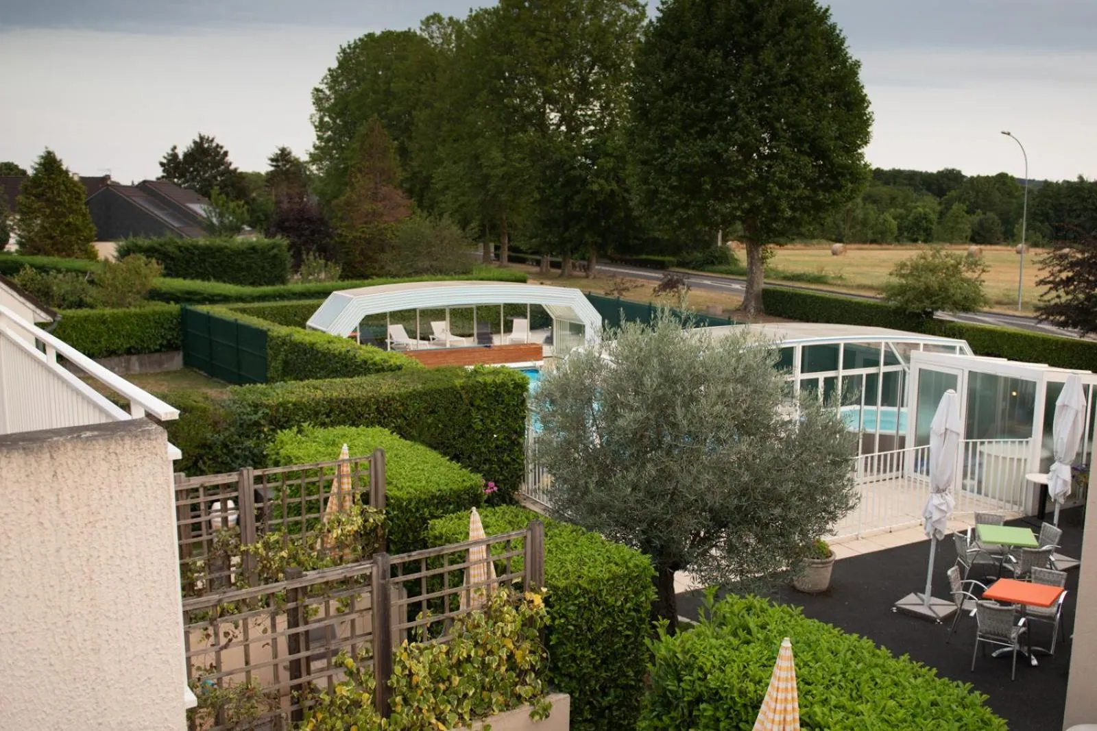 Garden in Logis Hotel Restaurant L'Escapade