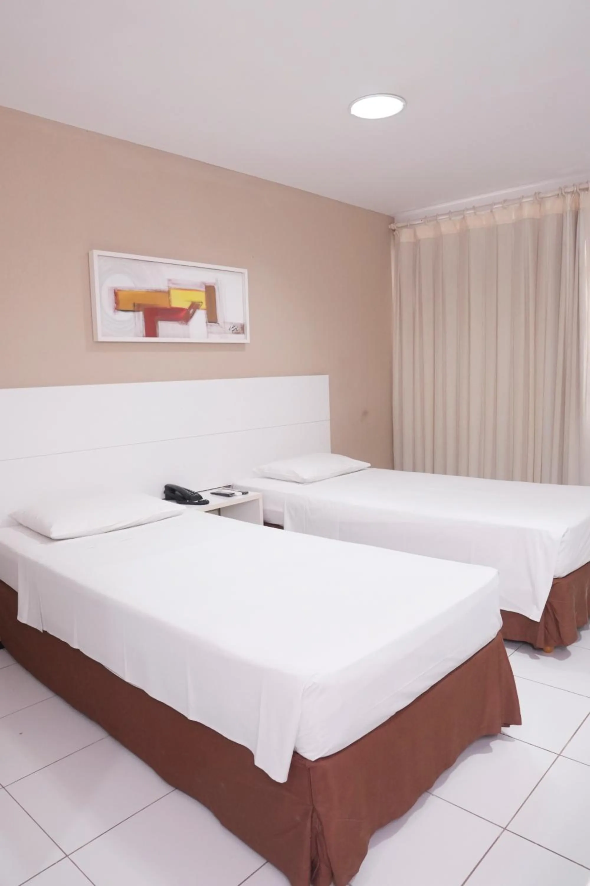 Bed in SLZ Lagoa Hotel