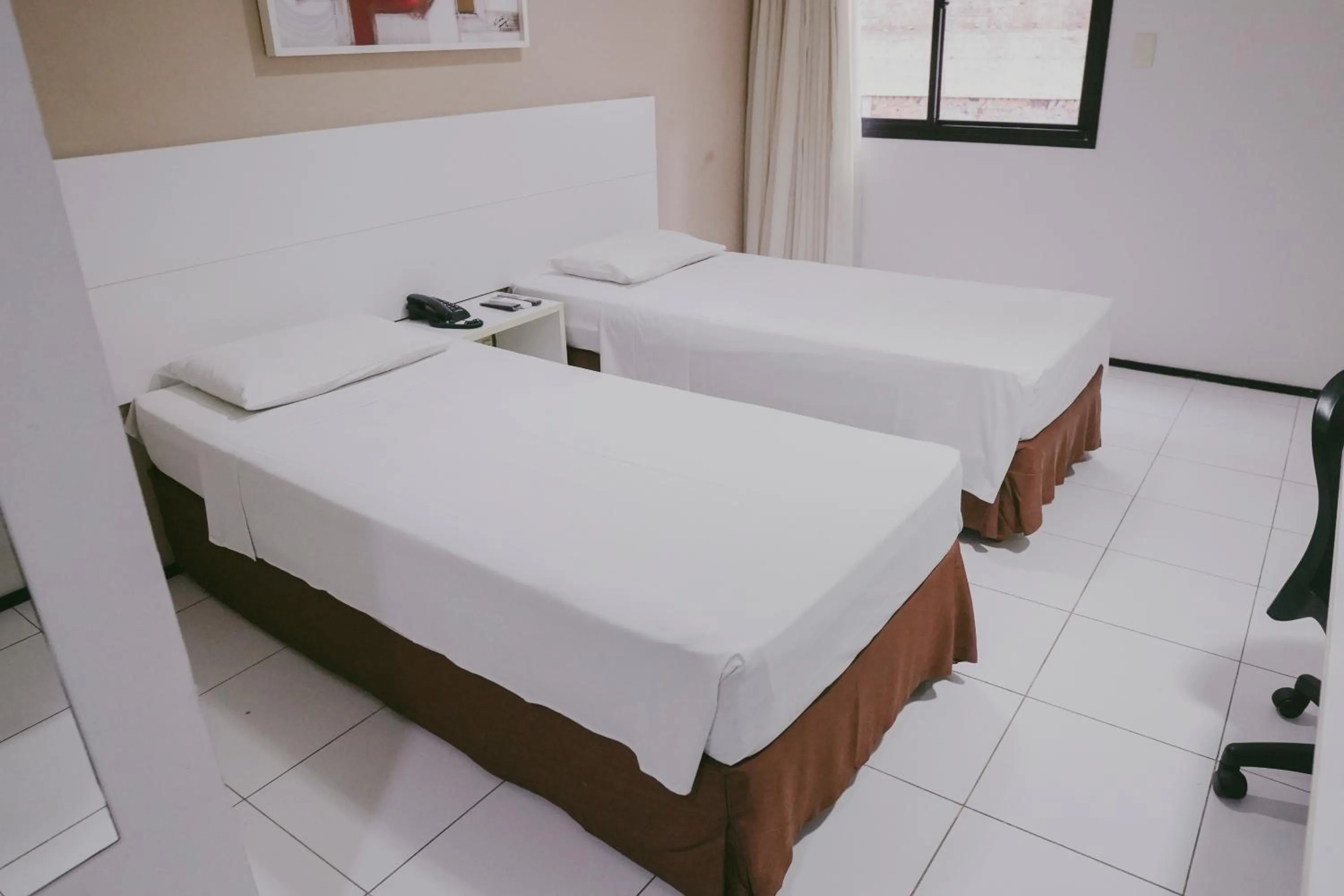 Bed in SLZ Lagoa Hotel