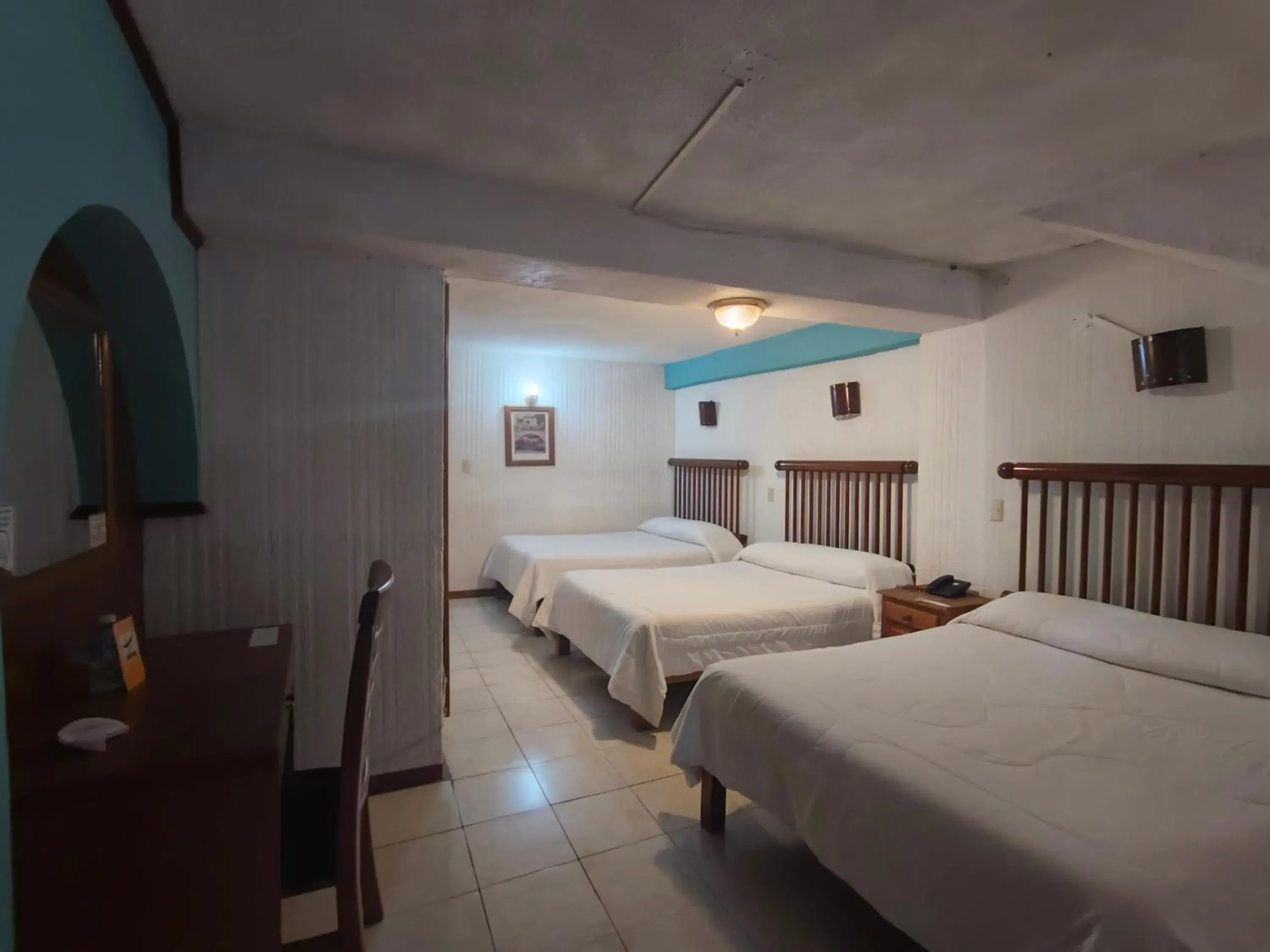 Standard Triple Room in Posada Tolosa Standard Triple Room in Posada Tolosa