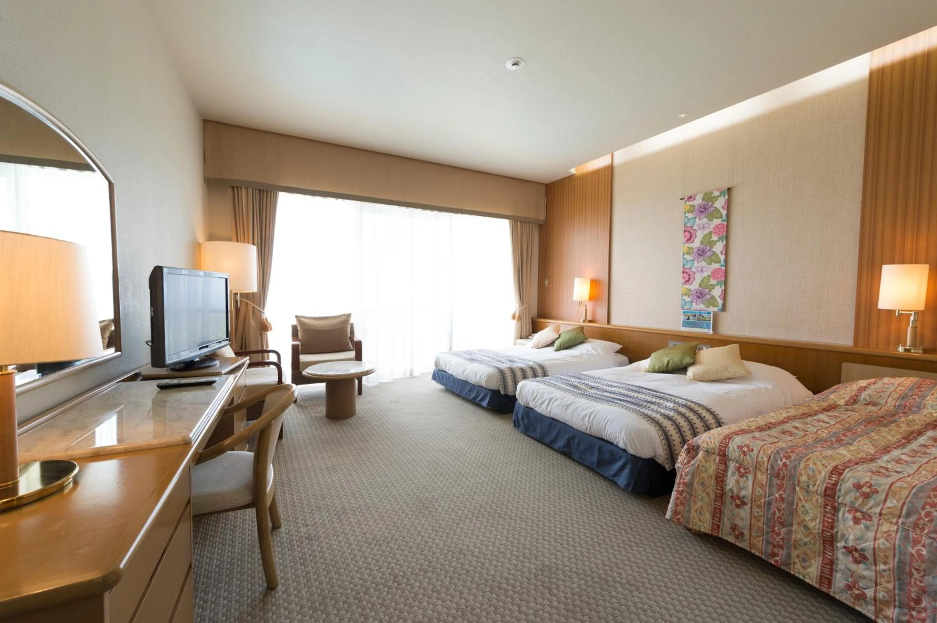 Living room, Bed in The Southern Links Resort Hotel