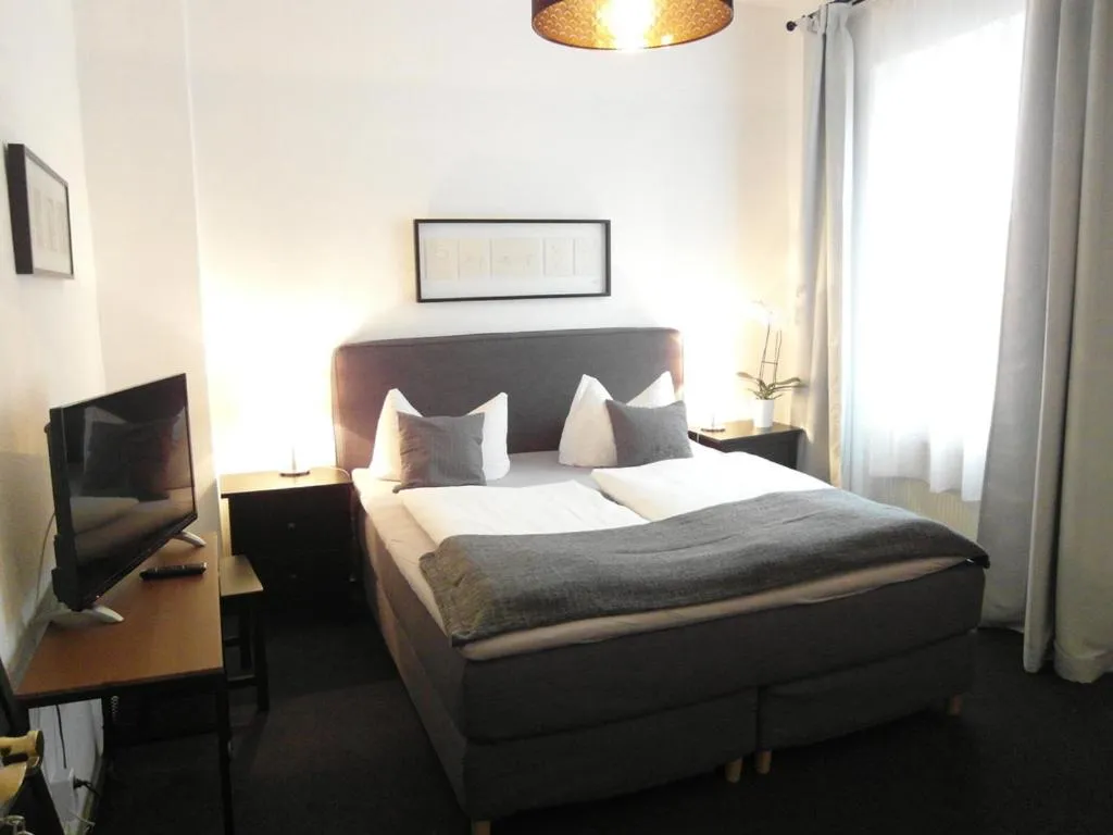 Bed in Hotel Frankfurter Hof