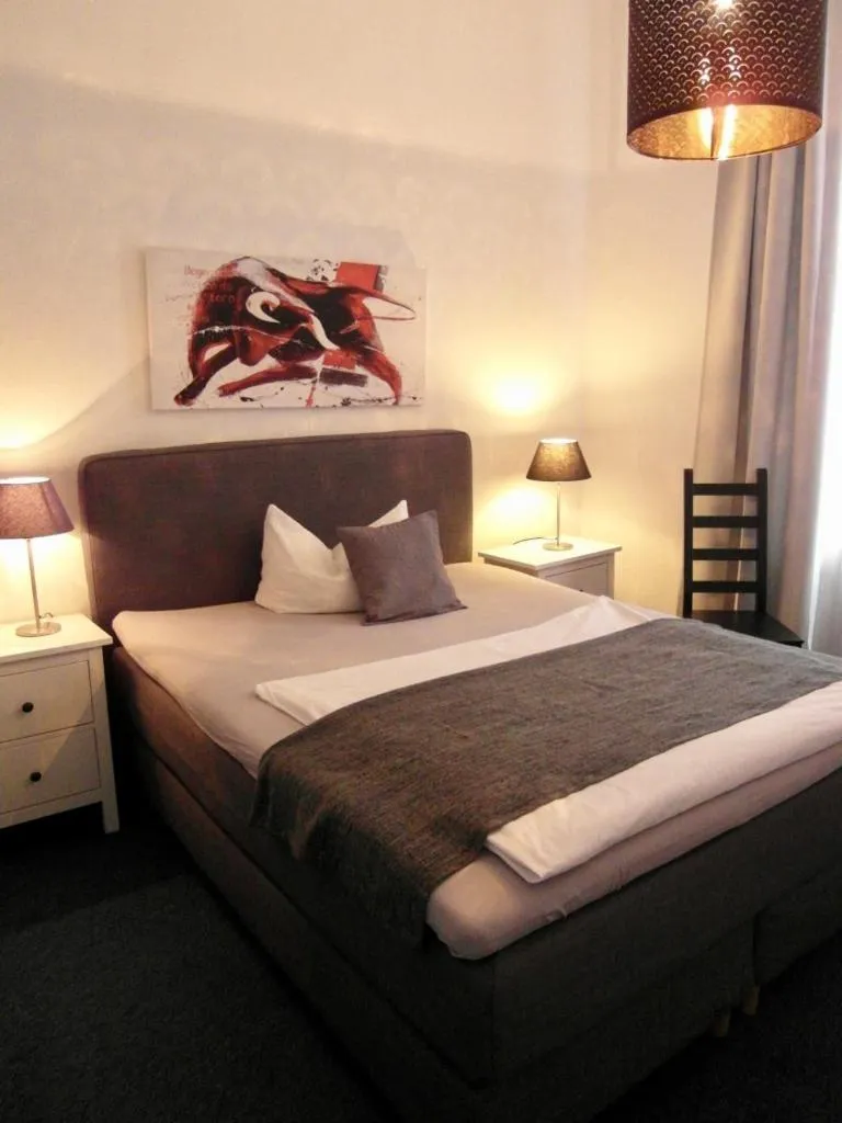 Bed in Hotel Frankfurter Hof