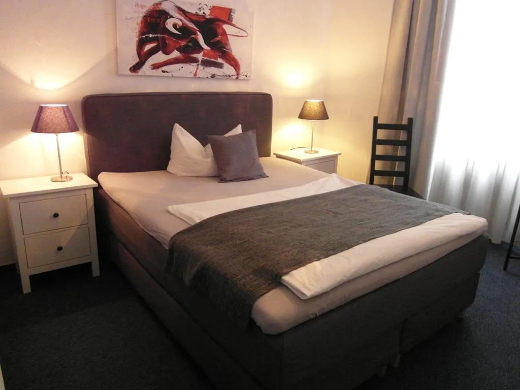 Bed in Hotel Frankfurter Hof
