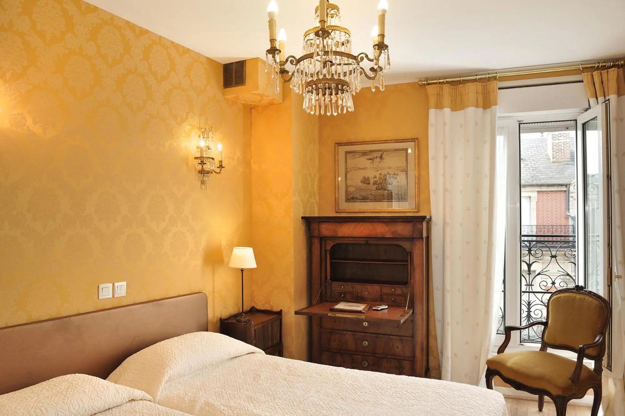 Photo of the whole room, Bed in Hôtel de l'Abeille