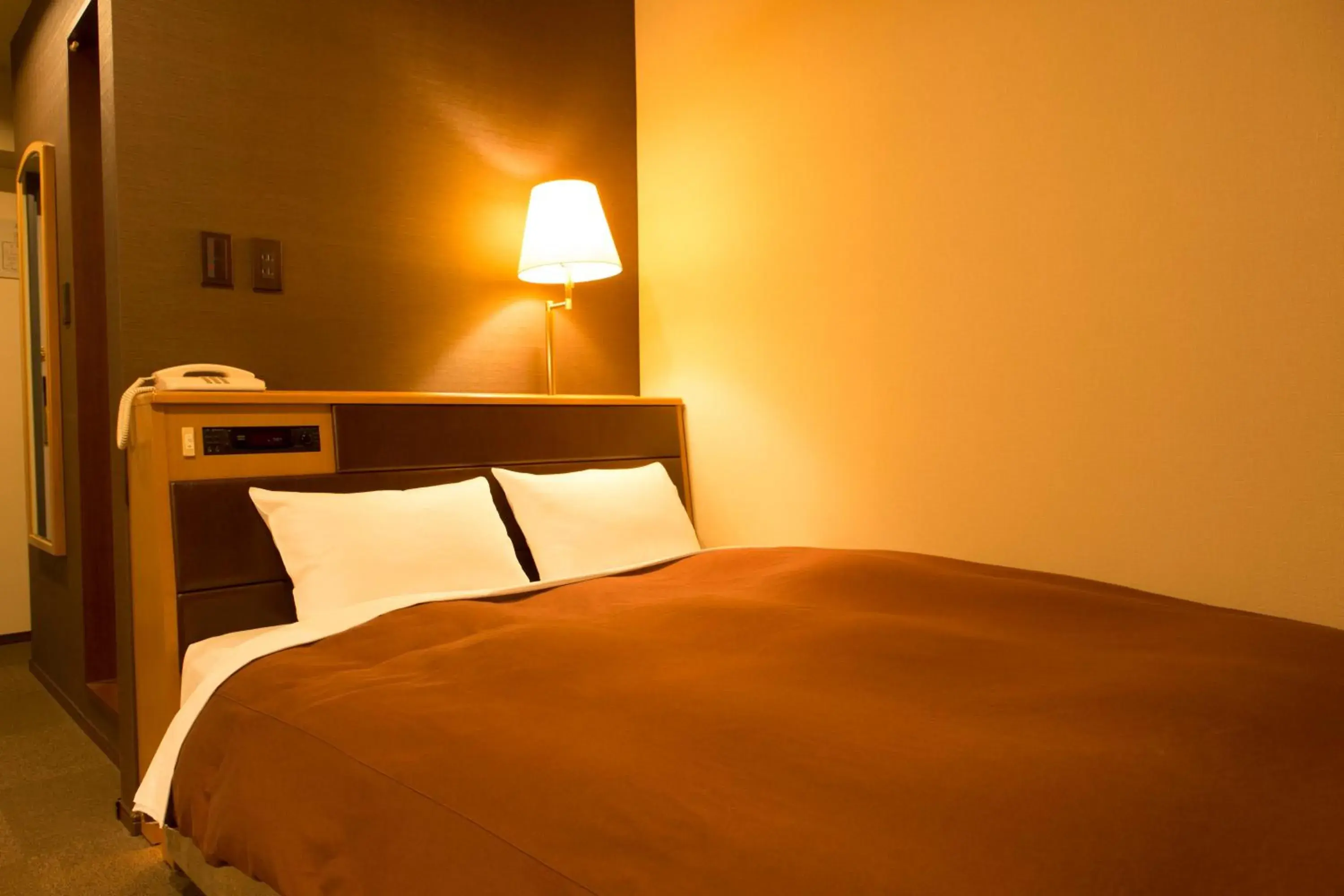 Bed in Nisshin Namba Inn Bed in Nisshin Namba Inn