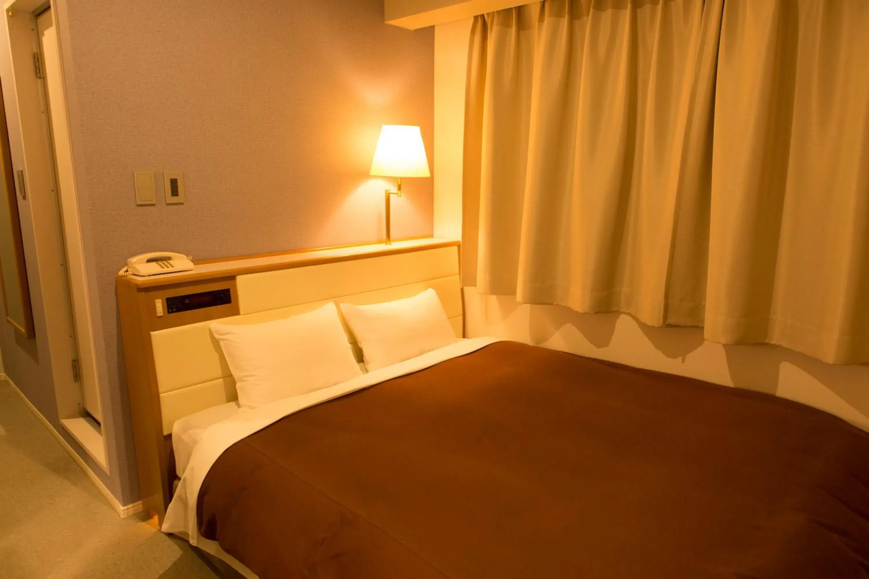 Bed in Nisshin Namba Inn Bed in Nisshin Namba Inn