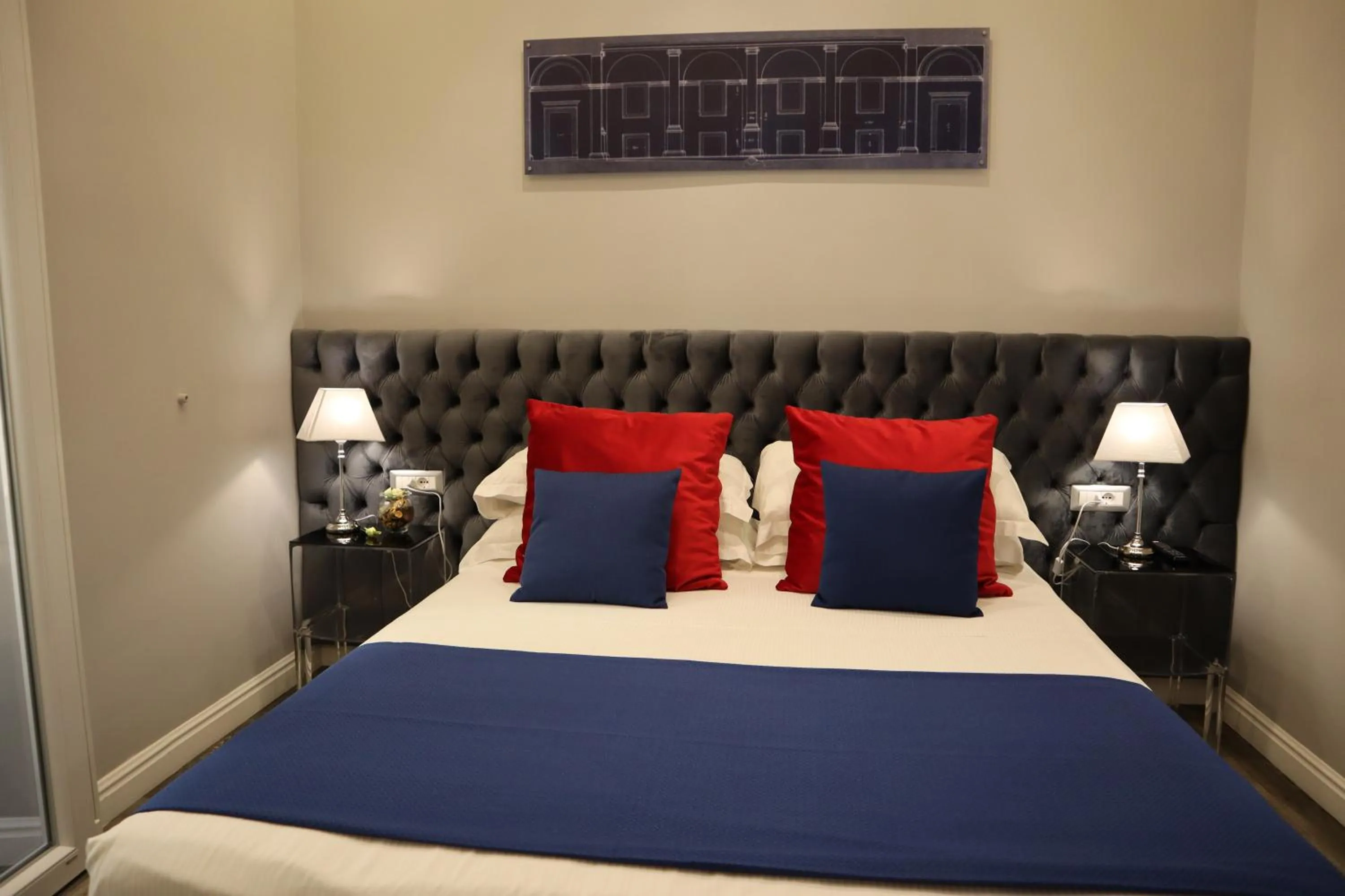 Photo of the whole room, Bed in MILLINA SUITES IN NAVONA