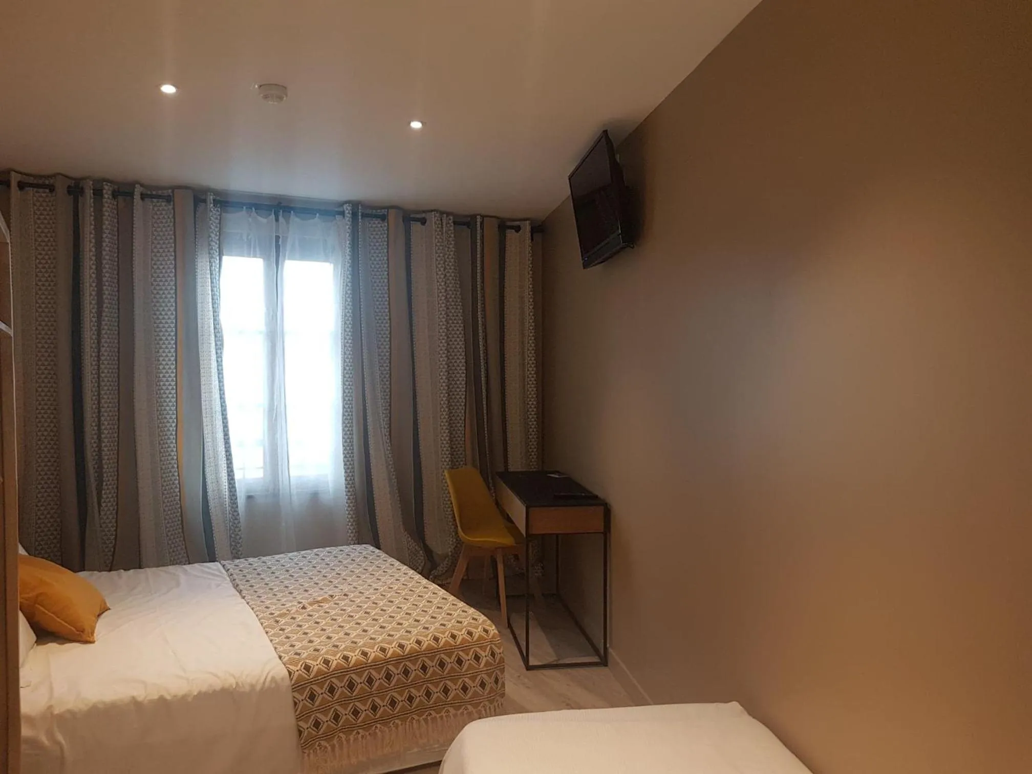 Bed in Logis Hôtel Terre de Loire