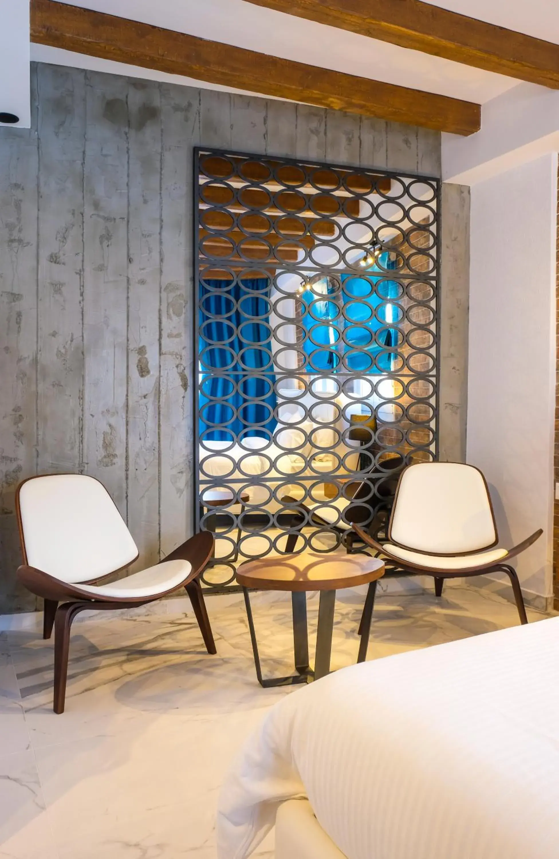 Seating area, Bed in Royal Hotel and Suites Seating area, Bed in Royal Hotel and Suites