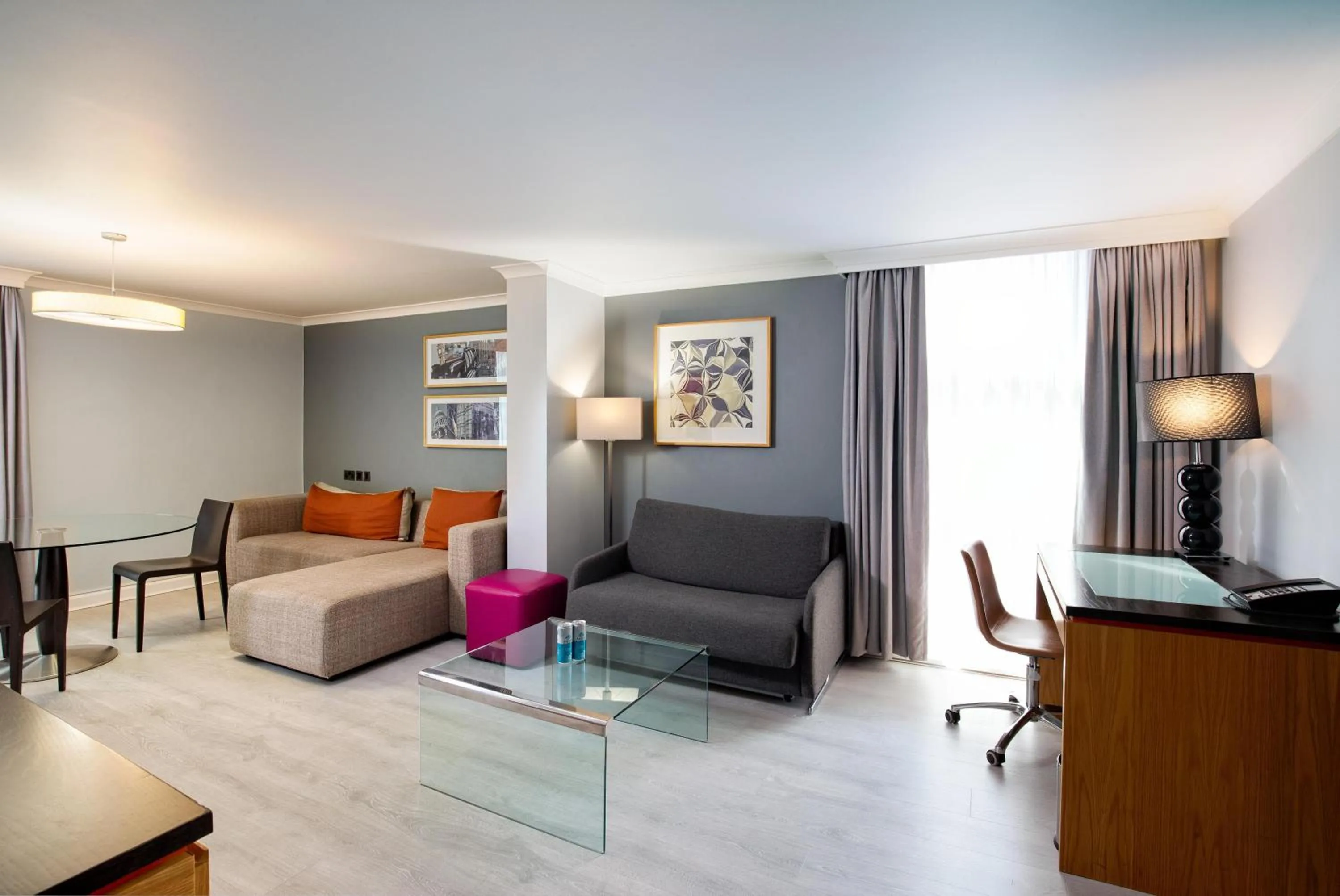 Living room, Bed in Hilton London Kensington Hotel