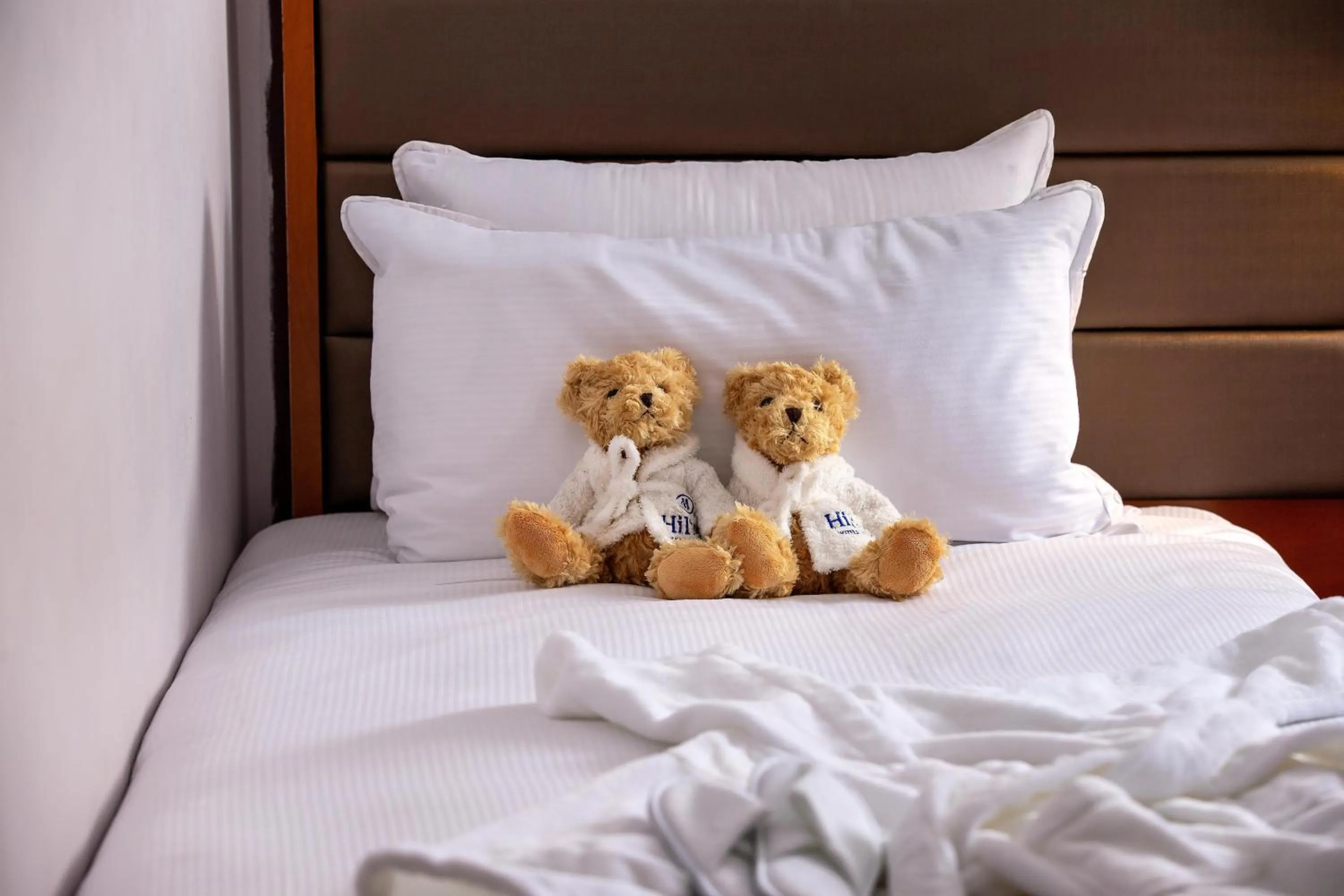 Bed in Hilton London Kensington Hotel