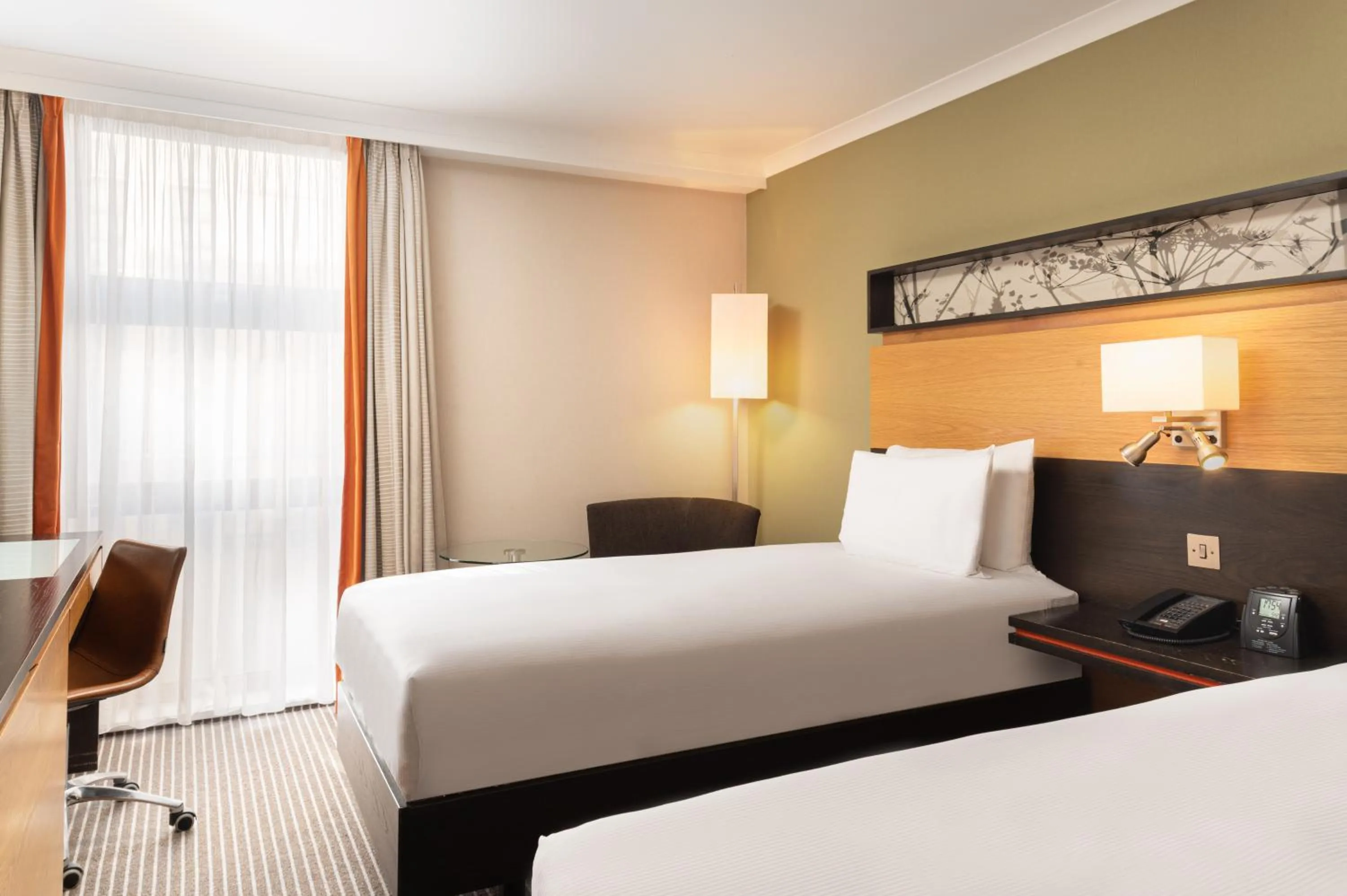 Bed in Hilton London Kensington Hotel