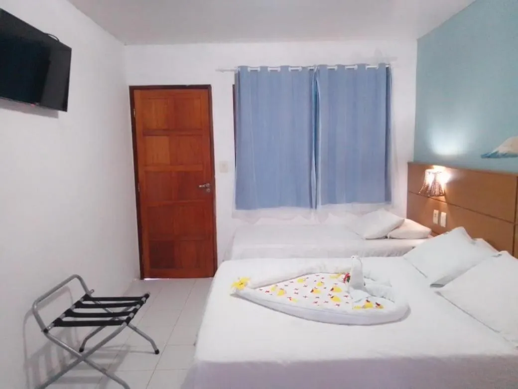 Photo of the whole room, Bed in Pousada Lua Azul