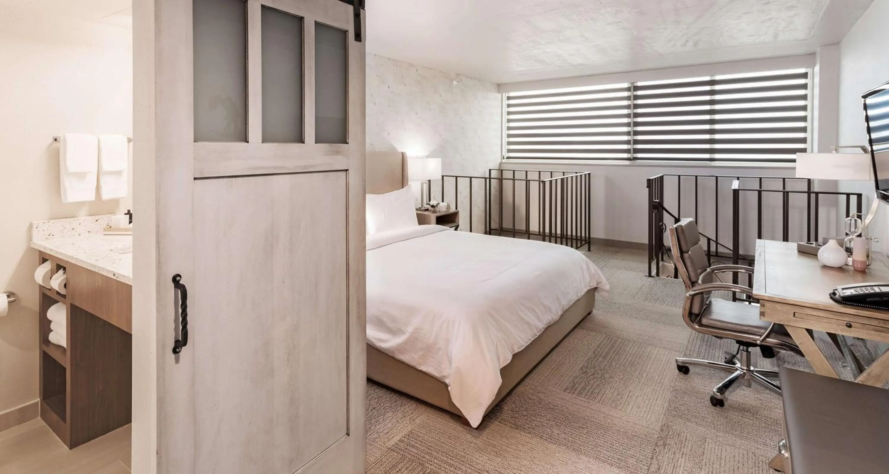 Photo of the whole room, Bed in The Rushmore Hotel & Suites; BW Premier Collection