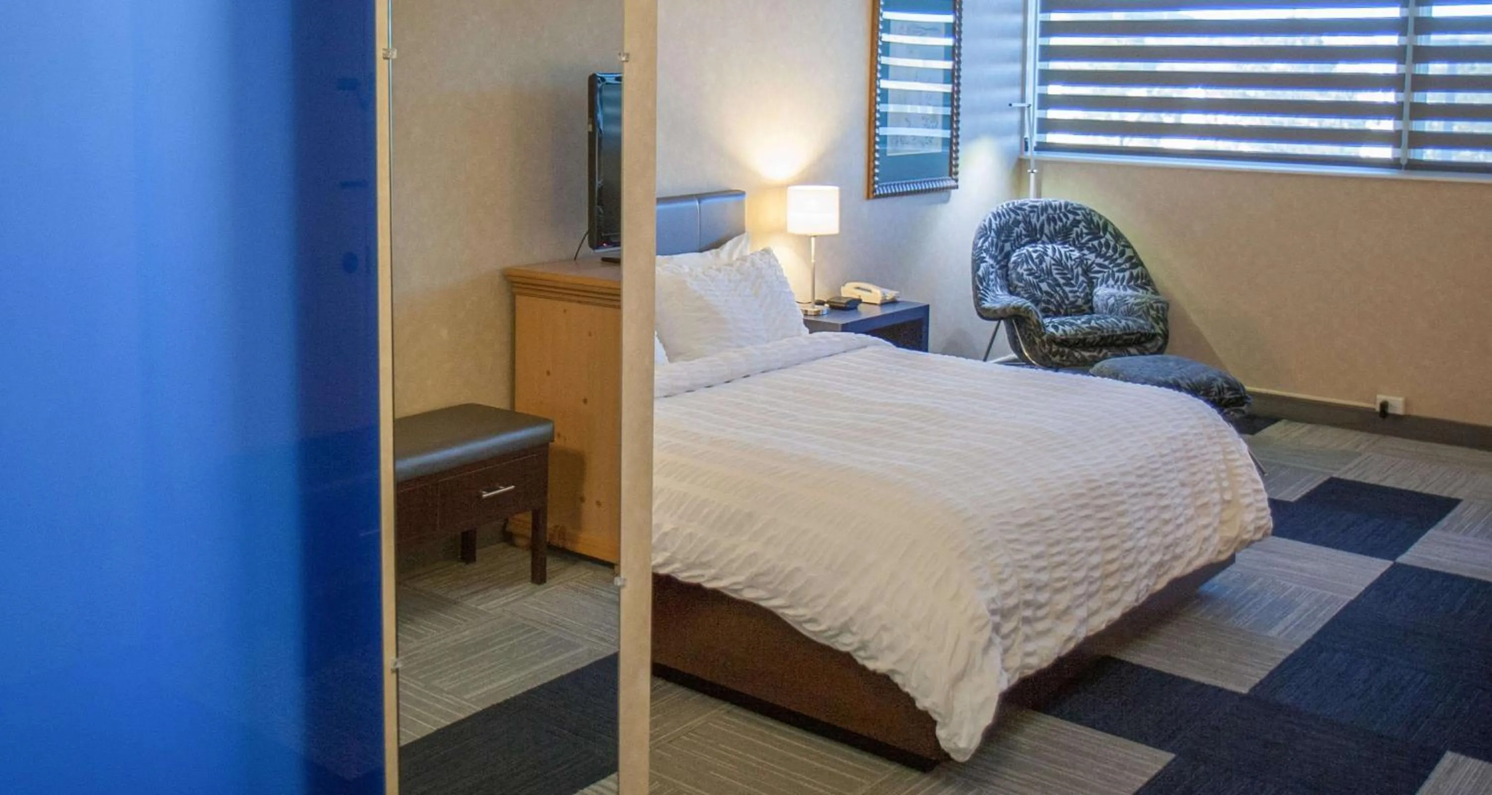 Photo of the whole room, Bed in The Rushmore Hotel & Suites; BW Premier Collection