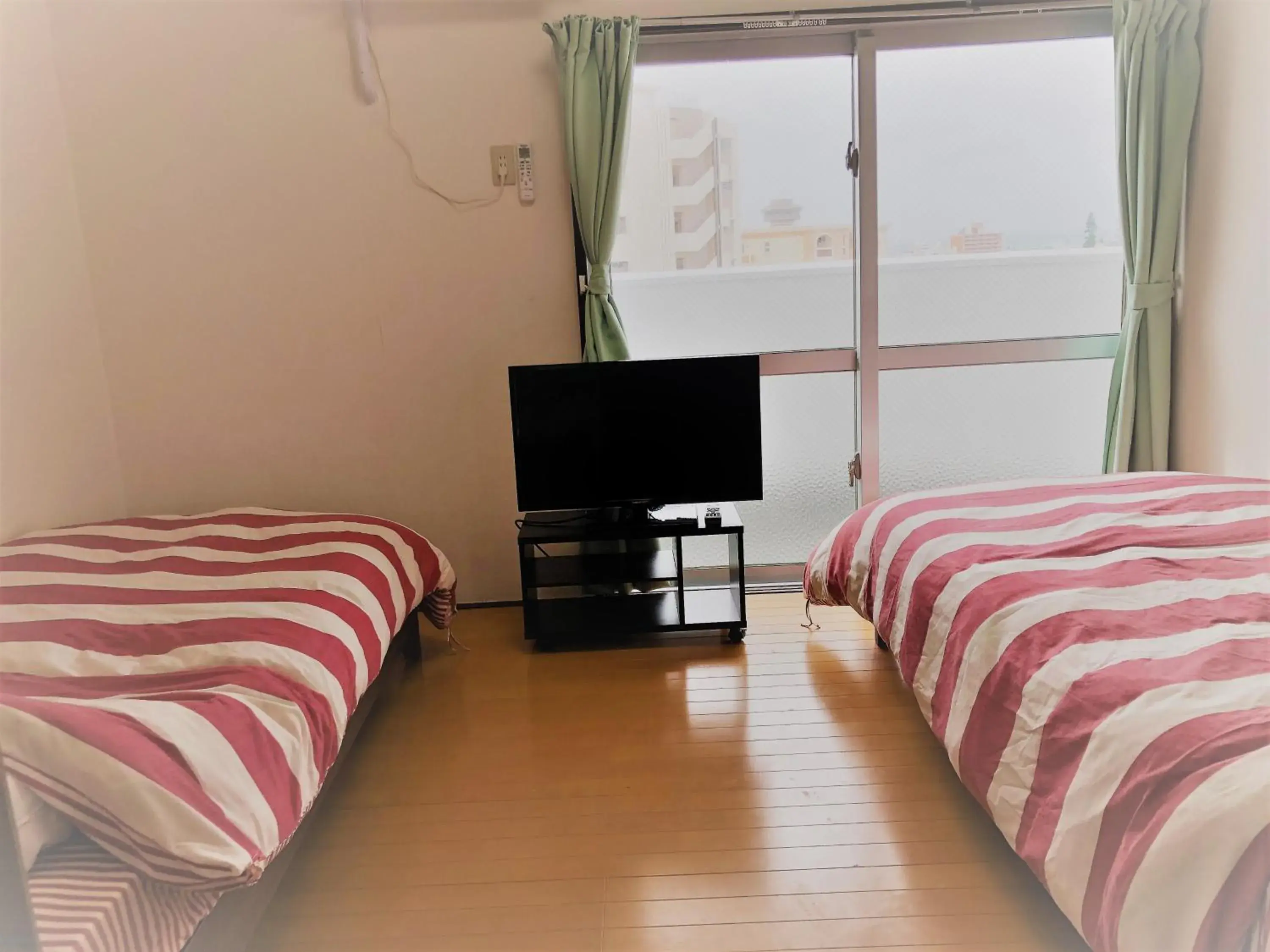 Photo of the whole room in Sunset Hills Inn Naha Photo of the whole room in Sunset Hills Inn Naha