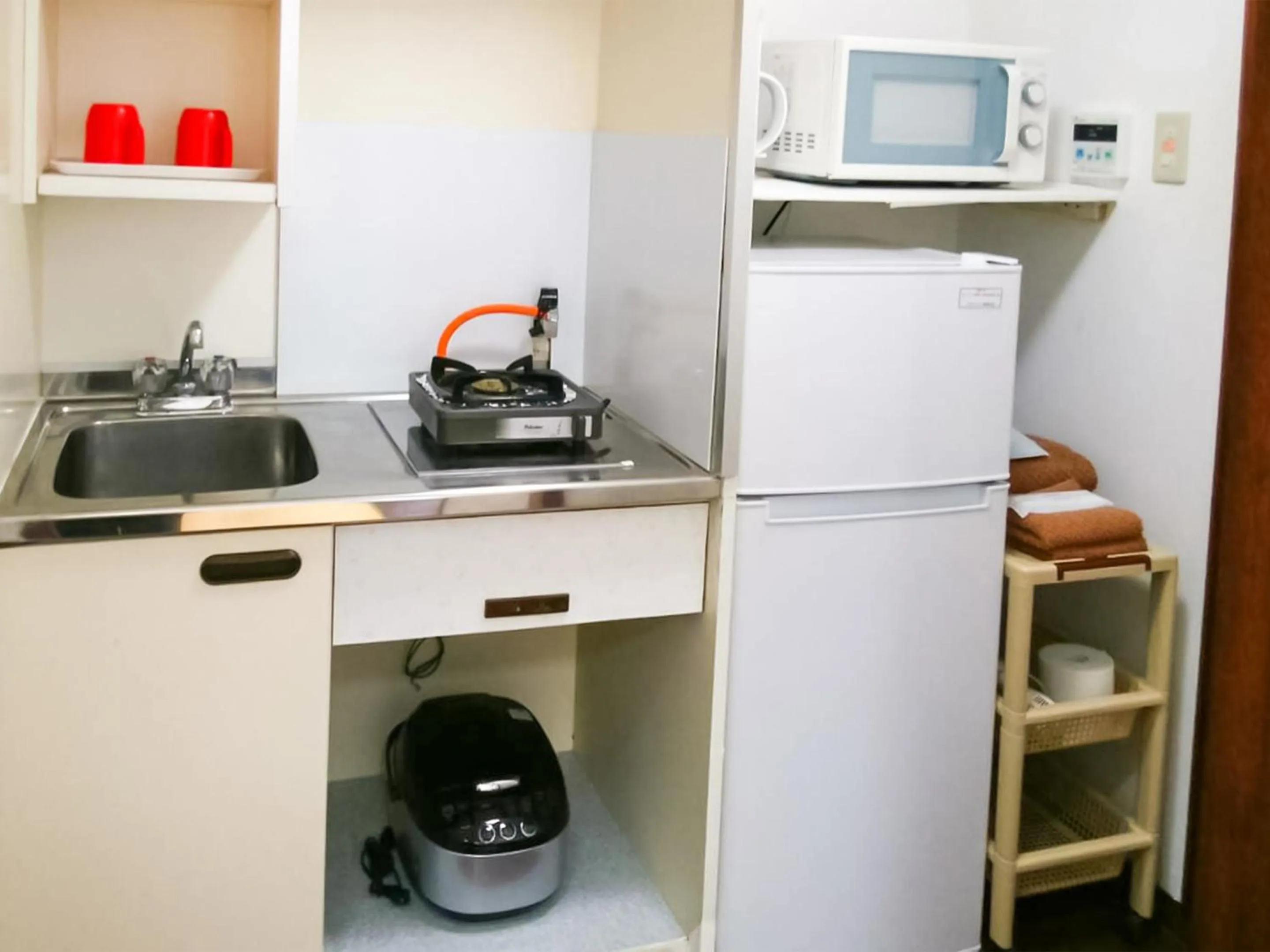Kitchen or kitchenette in Sunset Hills Inn Naha