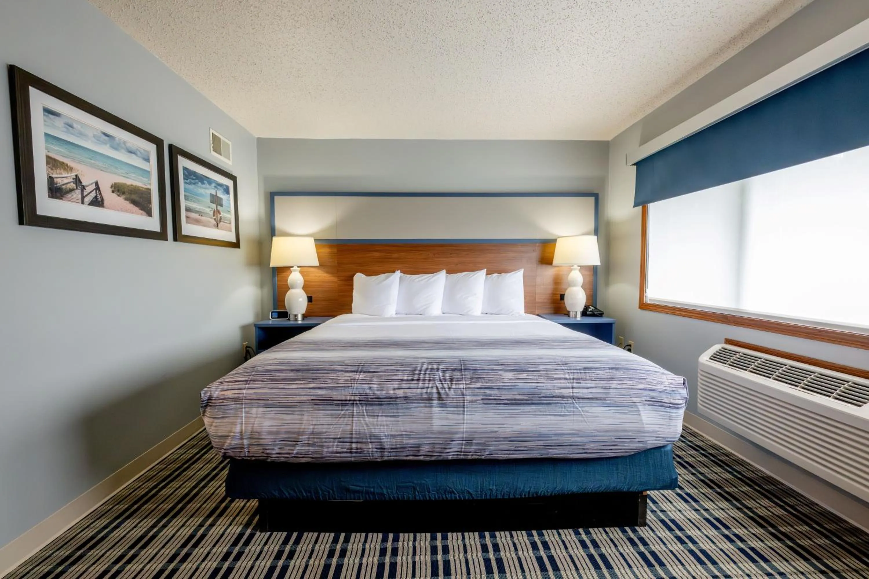 Bed in AmericInn by Wyndham Sturgeon Bay