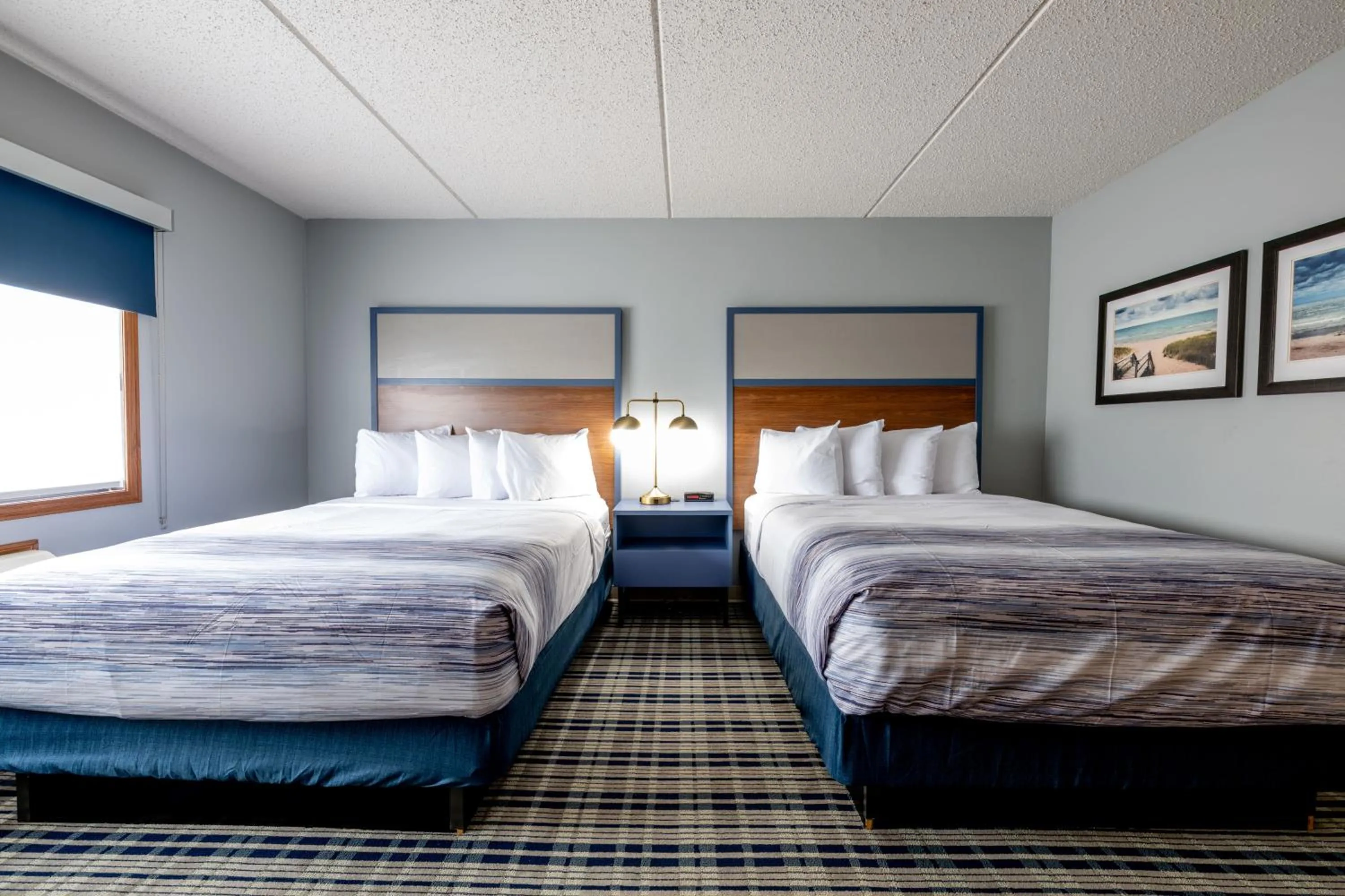 Bed in AmericInn by Wyndham Sturgeon Bay
