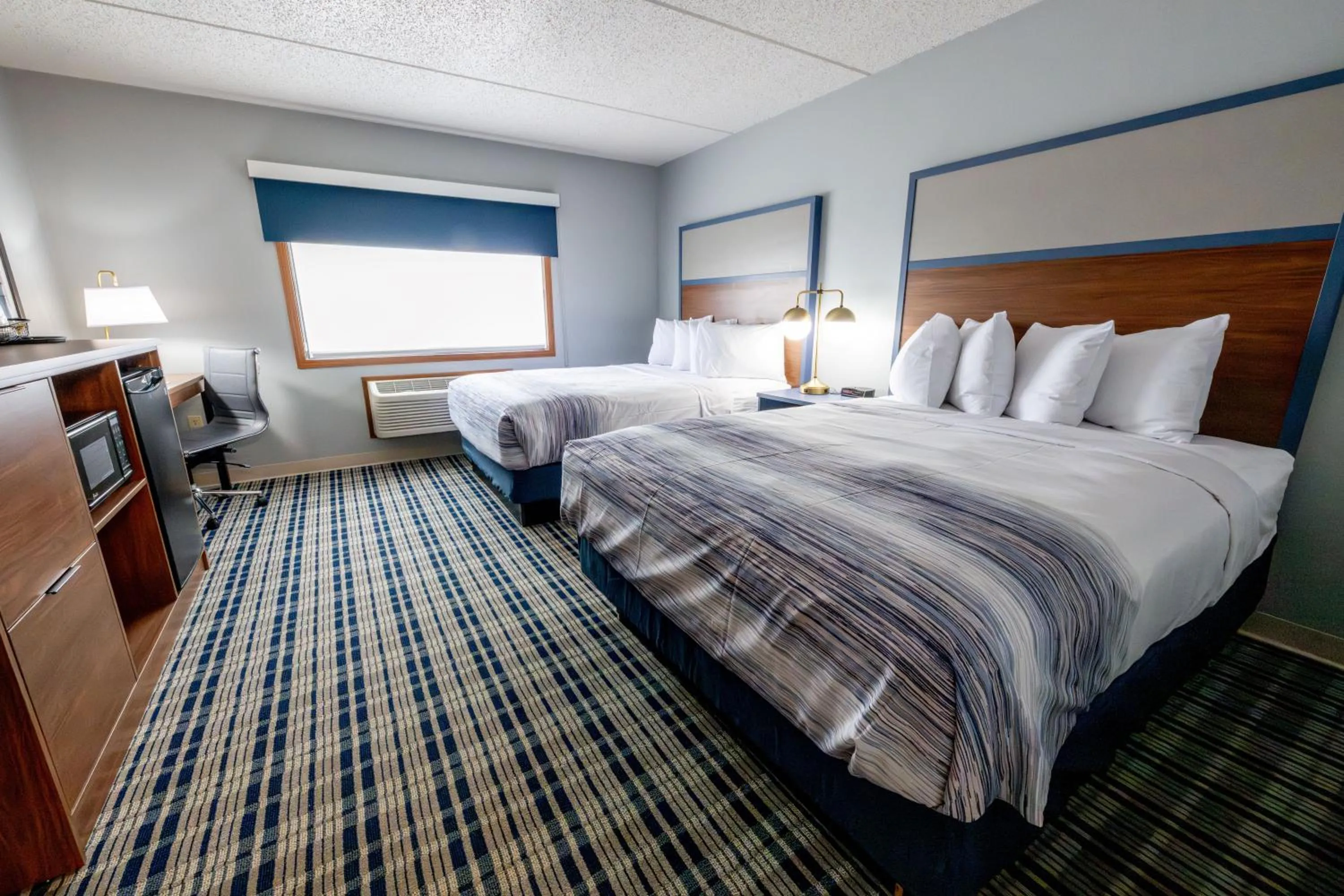 Bed in AmericInn by Wyndham Sturgeon Bay