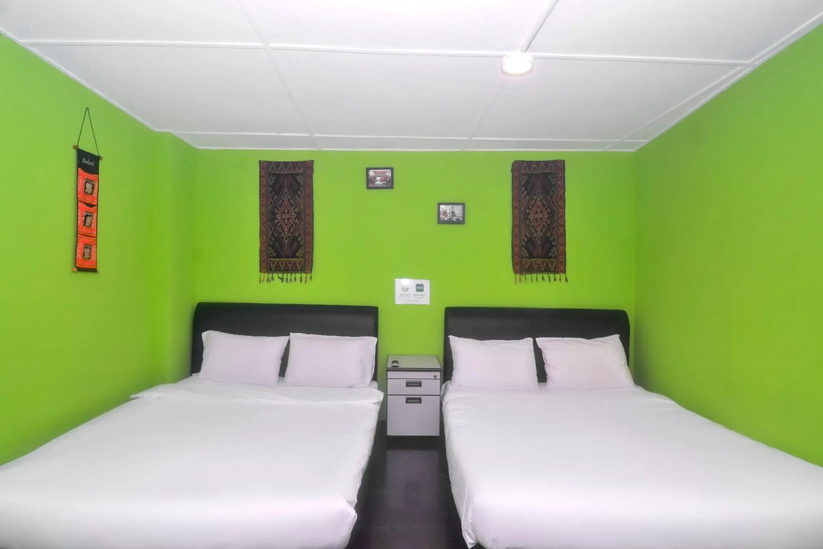 Bedroom in Hotel O Tropical Lodge Bedroom in Hotel O Tropical Lodge