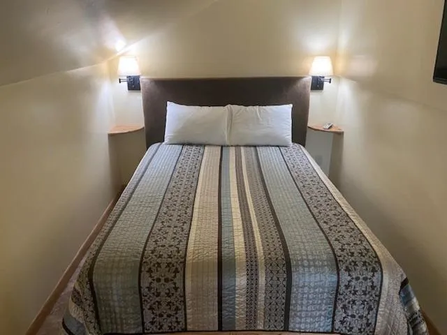 Bed in Yellowstone Riverside Cottages