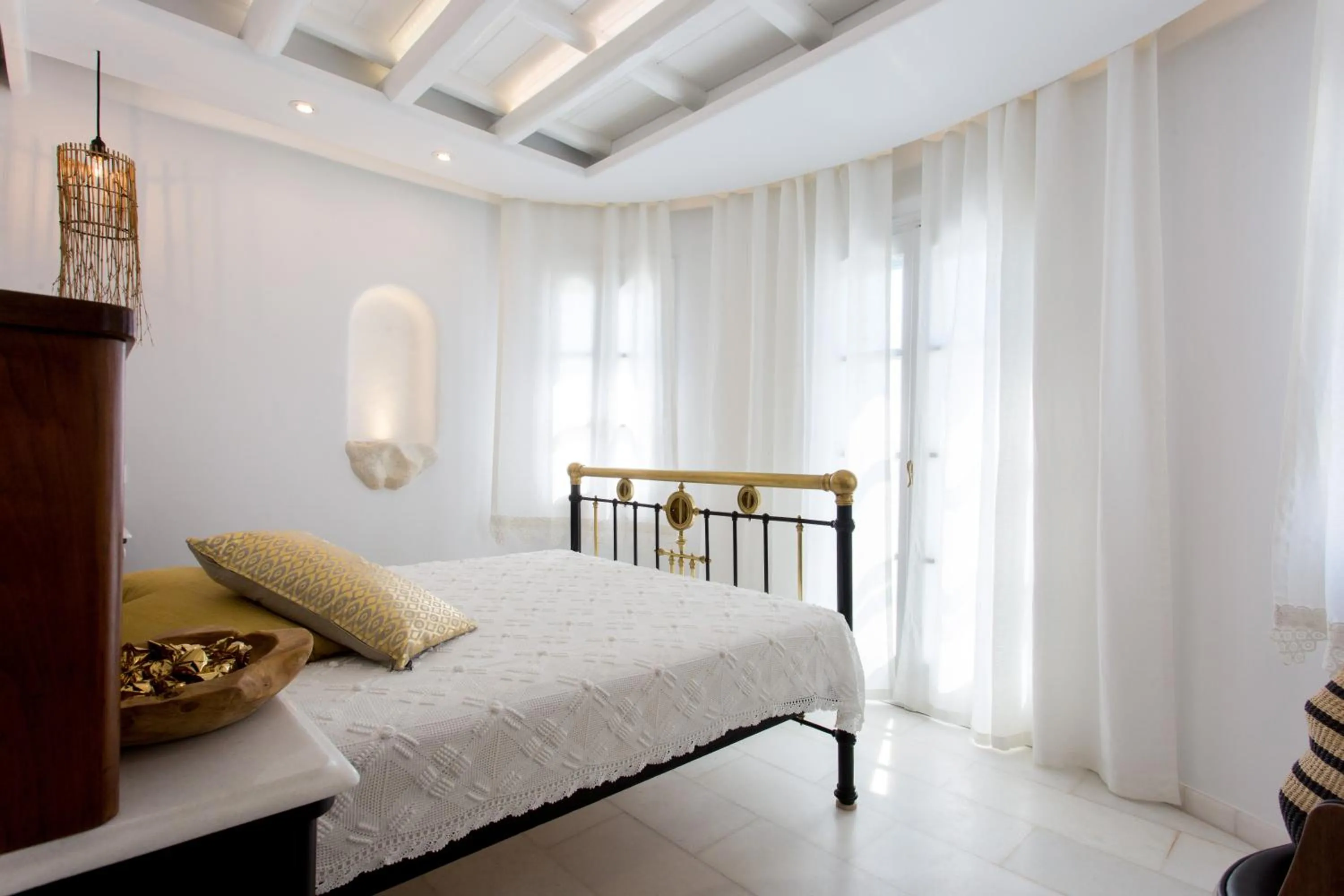 Bed in Naxian Riviera Exclusive Seafront Suites, Junior Suite
