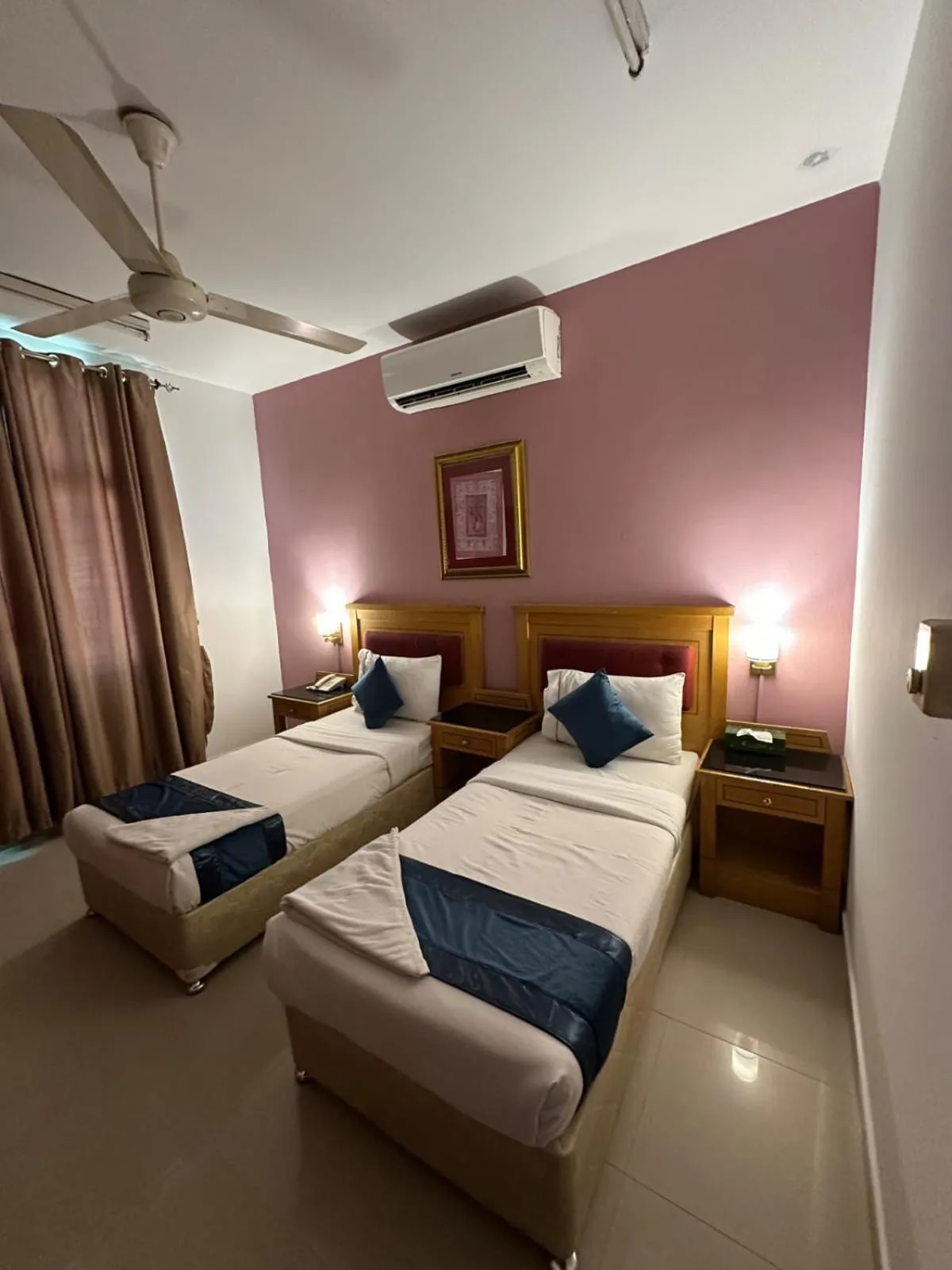 Bed in Savoy Inn Hotel Apartments