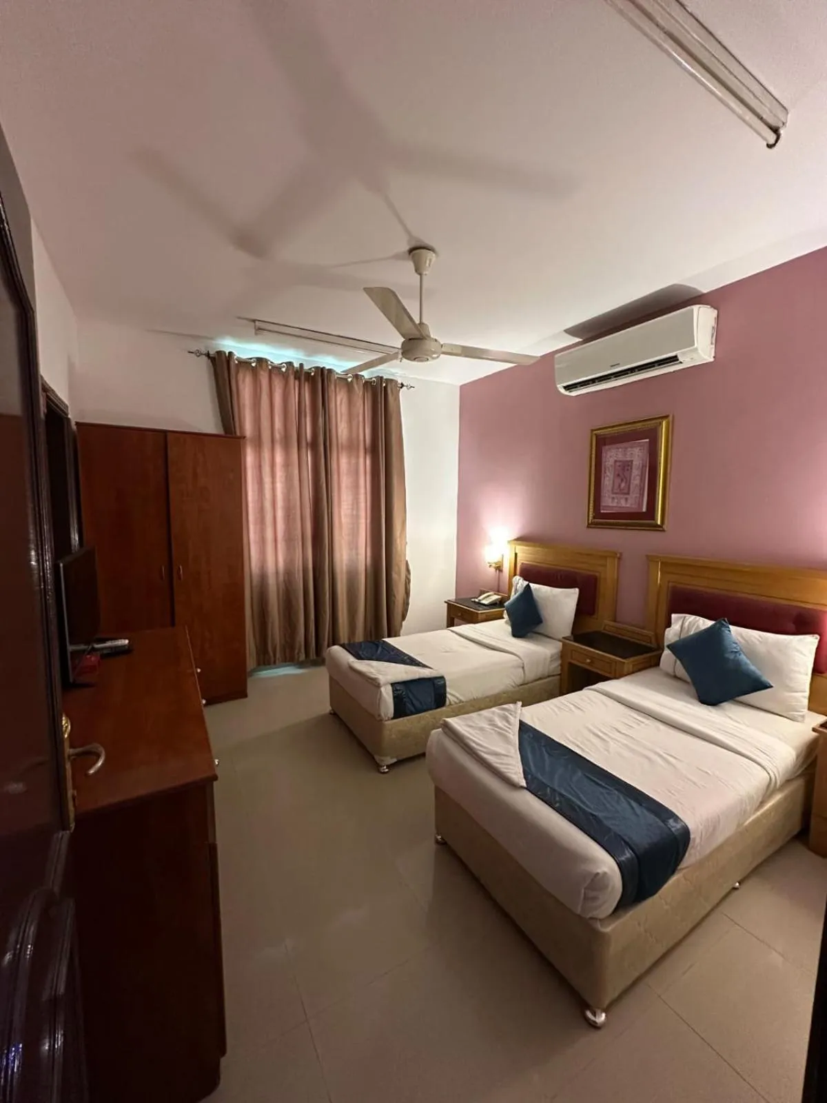 Bed in Savoy Inn Hotel Apartments