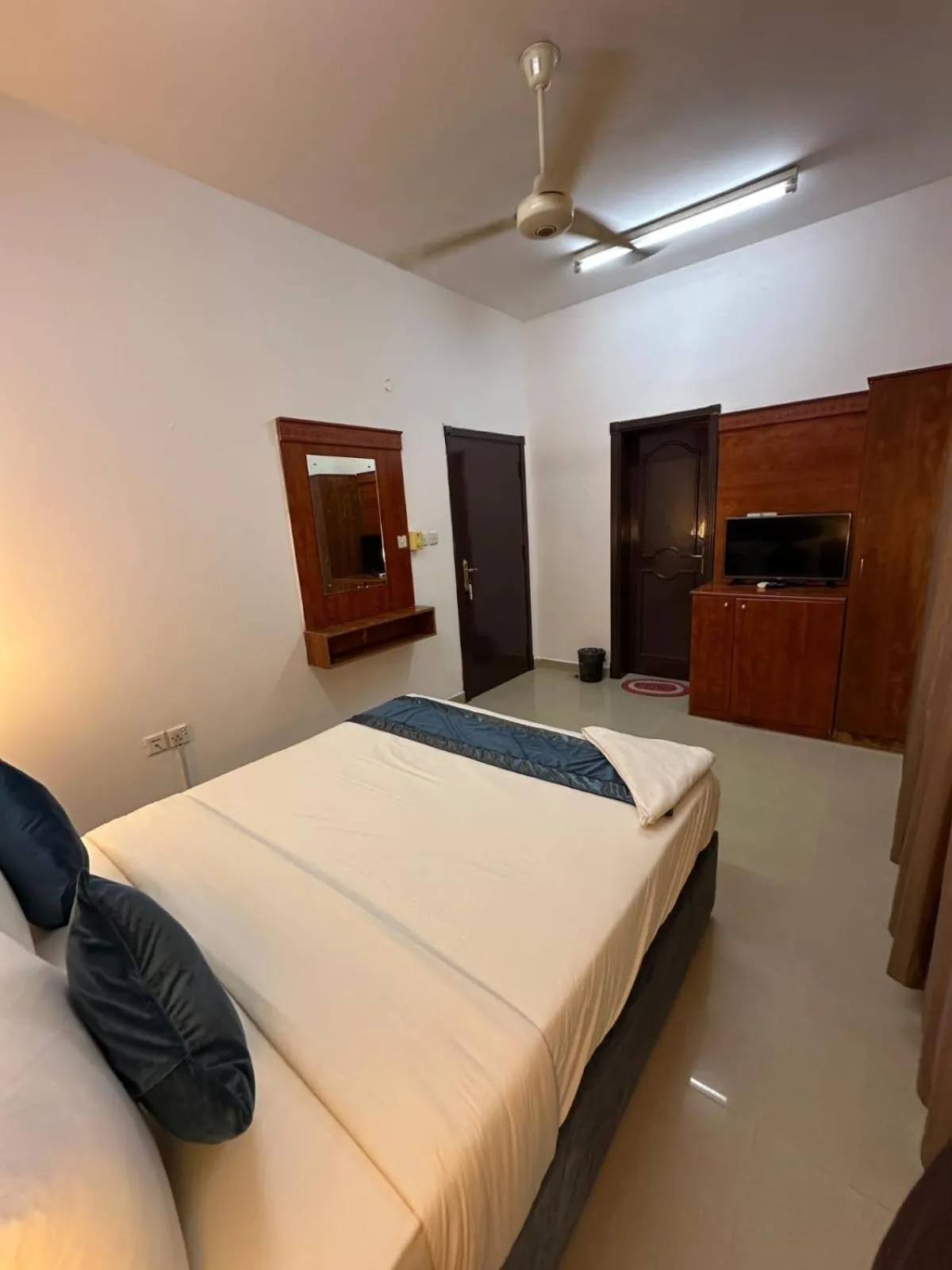 Bed in Savoy Inn Hotel Apartments