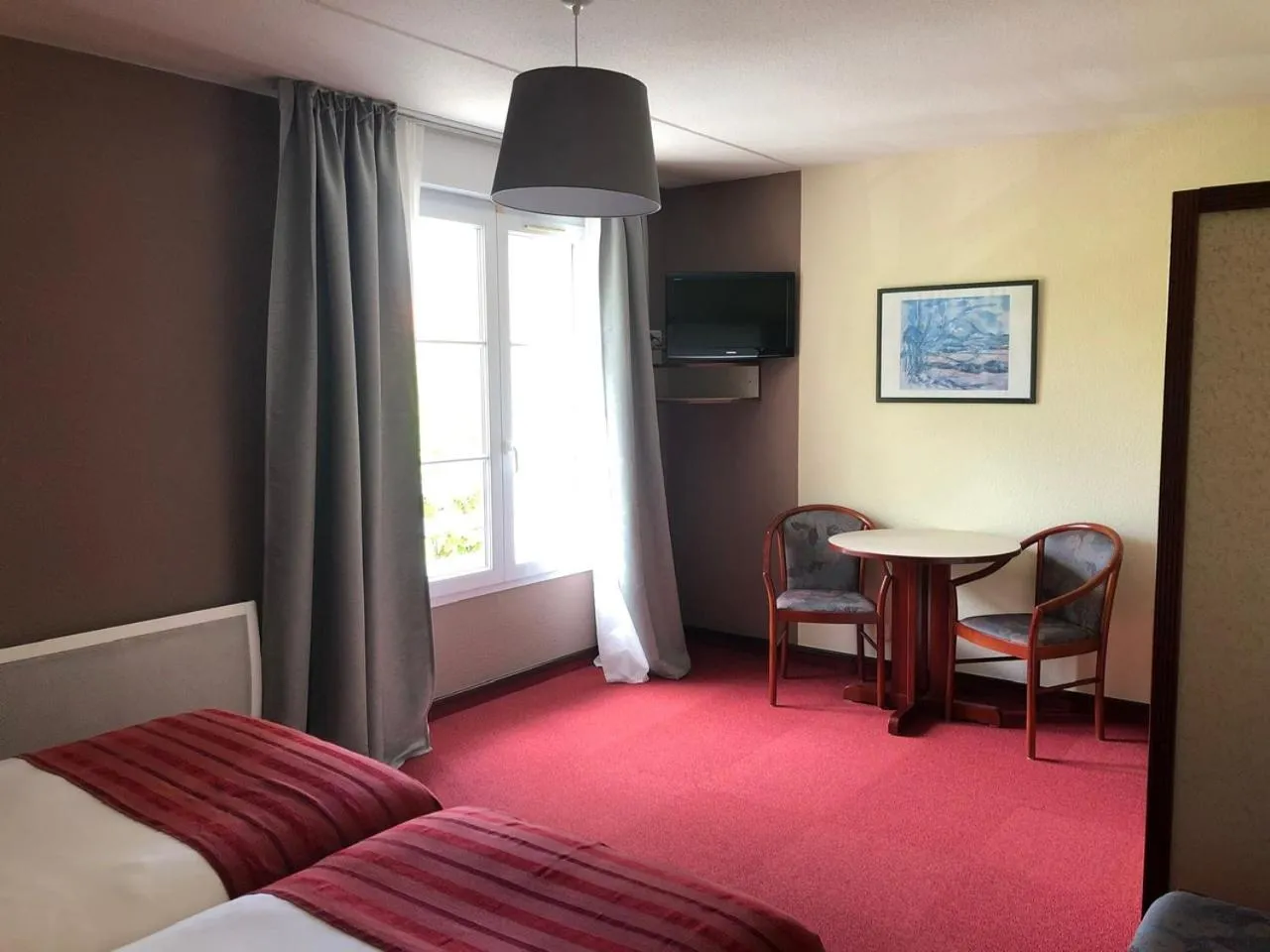 Bed in Hôtel et Studios d'Orfeuil