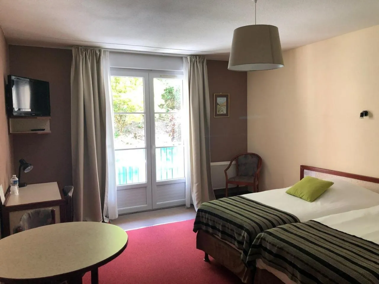 Bed in Hôtel et Studios d'Orfeuil