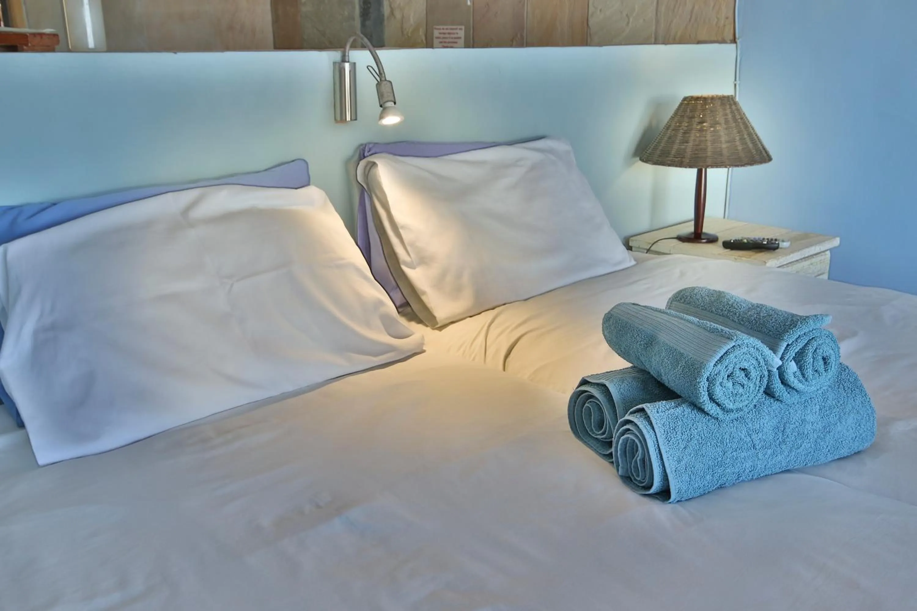 Bed in Oyster Bay Beach Lodge