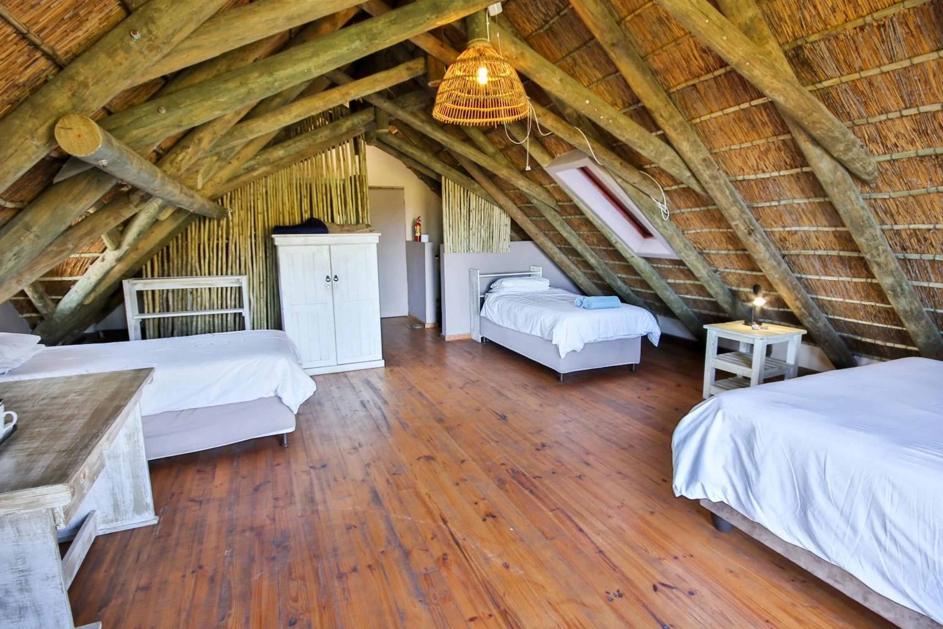 Bed in Oyster Bay Beach Lodge