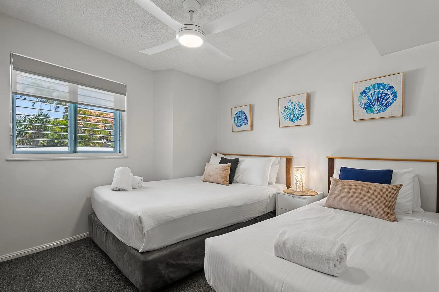 Bed in Grand Palais Boolarong Beachside Apartments