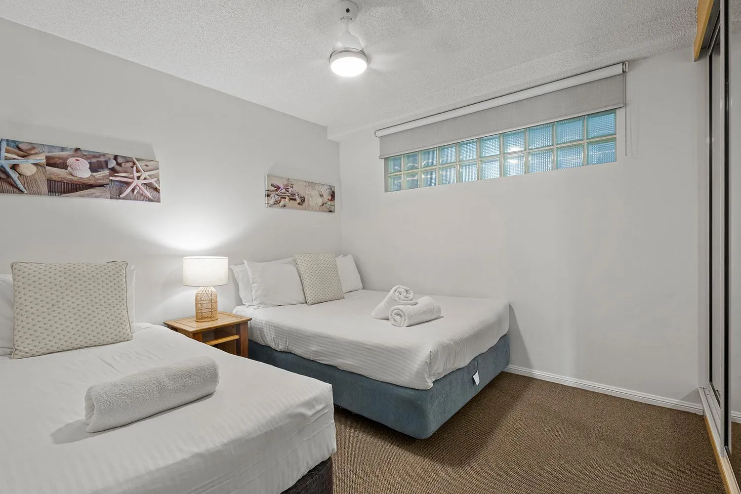 Bed in Grand Palais Boolarong Beachside Apartments