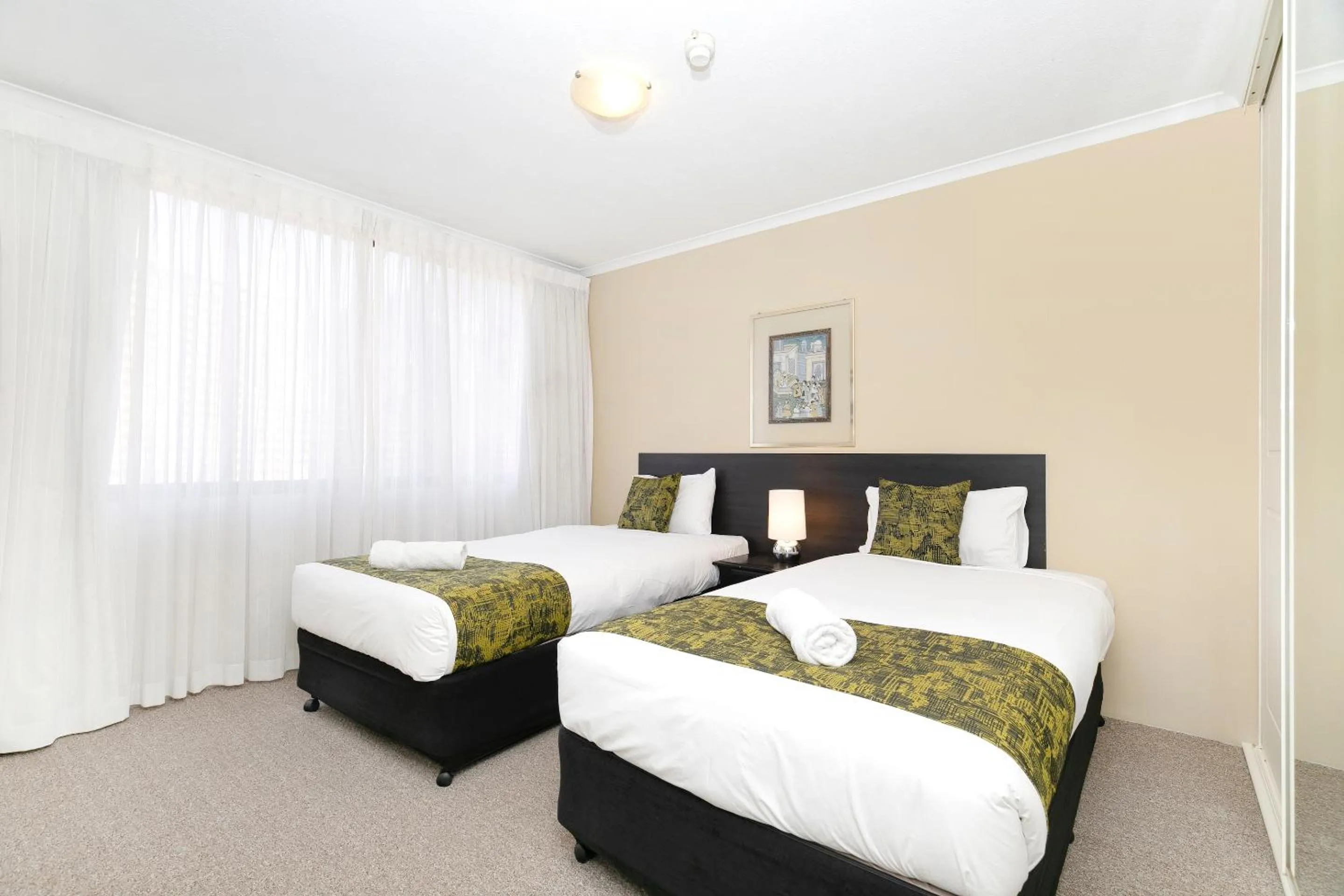 Bed in The Astor Apartments