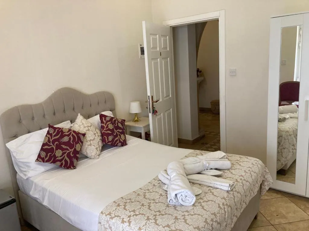 Bed in Lord's Residence Boutique Hotel