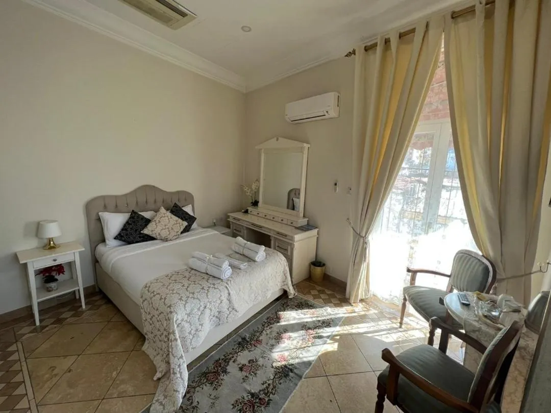 Bed in Lord's Residence Boutique Hotel