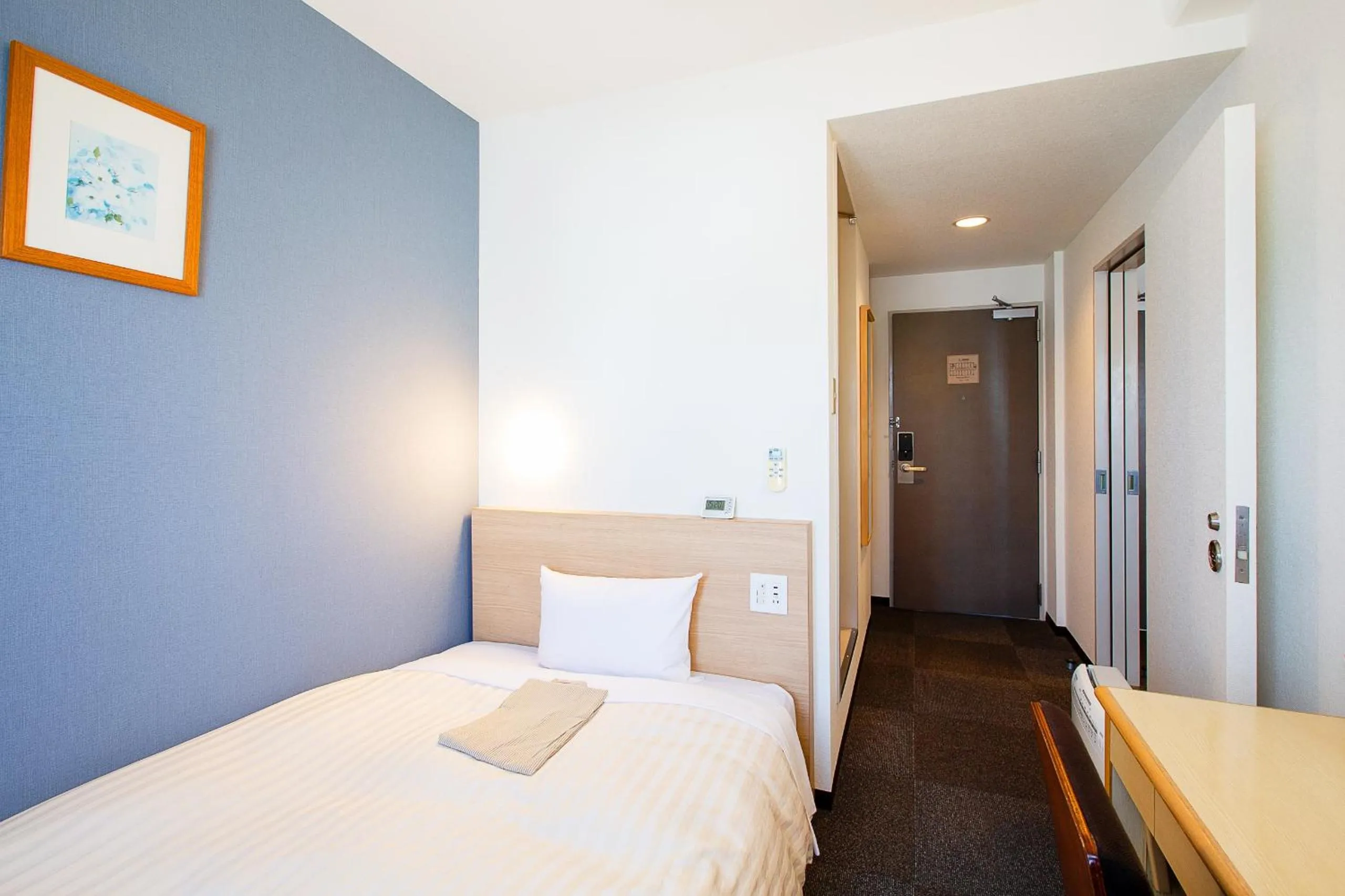 Bed in Super Hotel Matsuyama