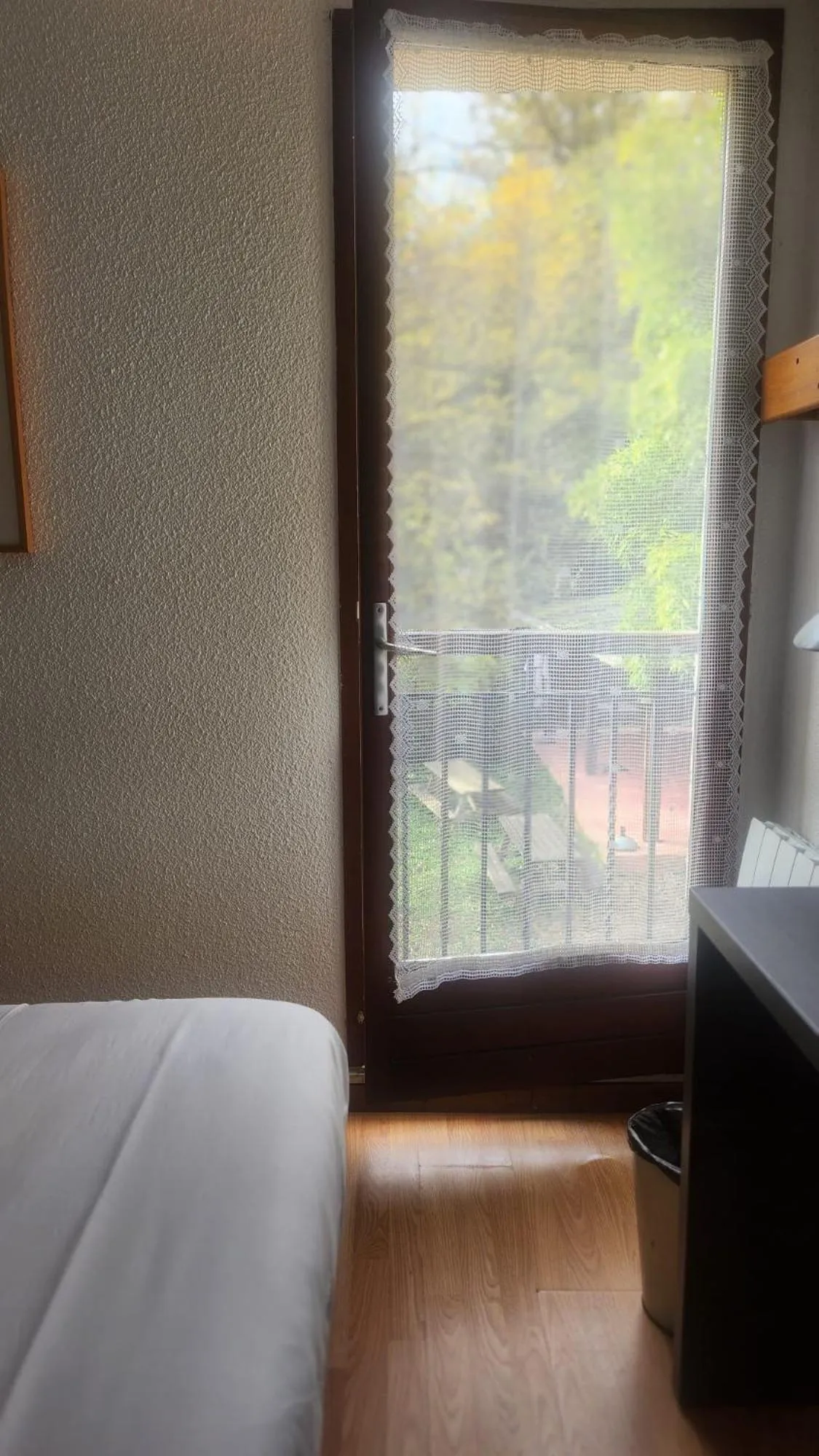 Bed in Logis Hôtel La Cascade