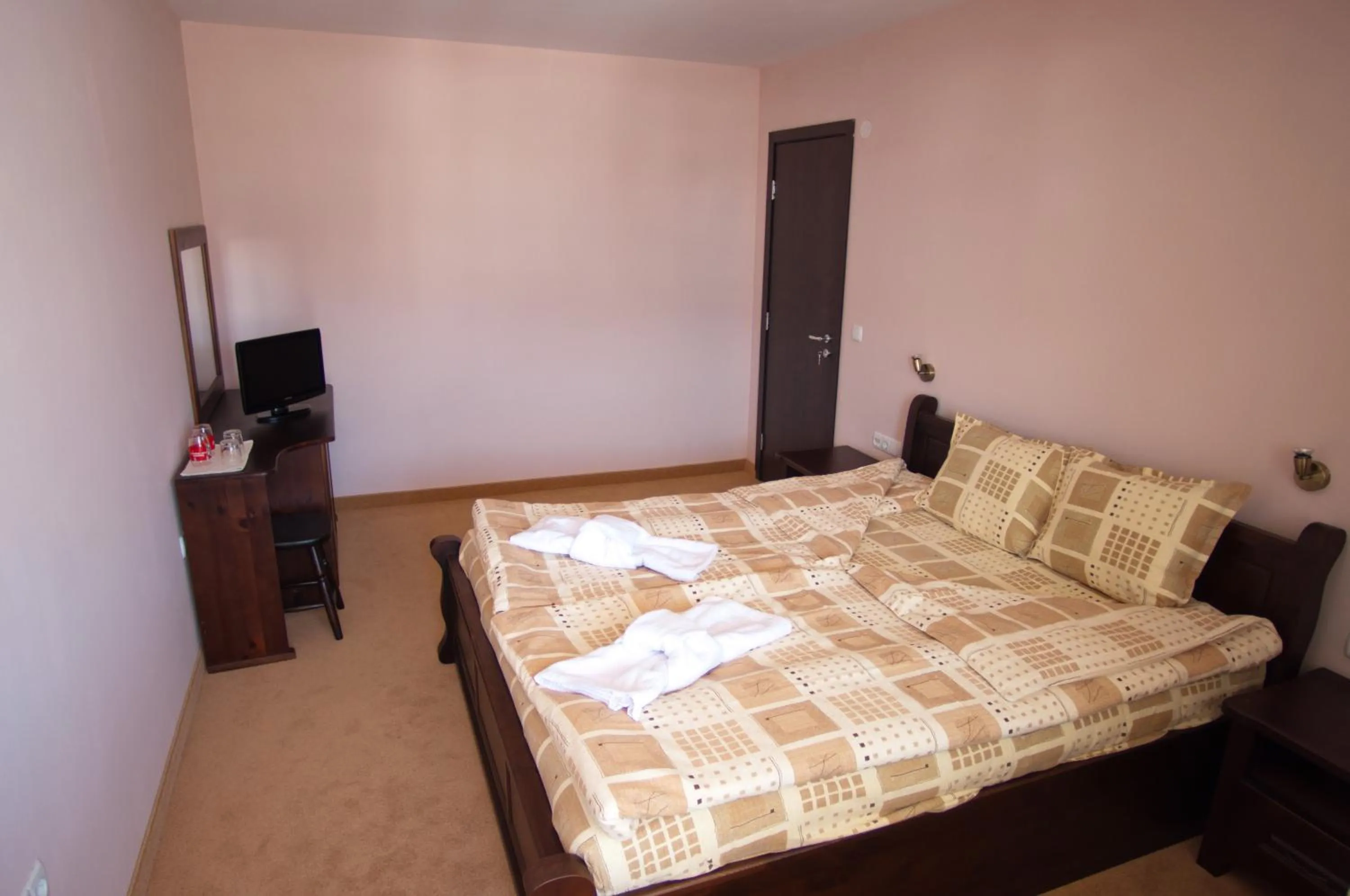 Bed in Family hotel Iskar