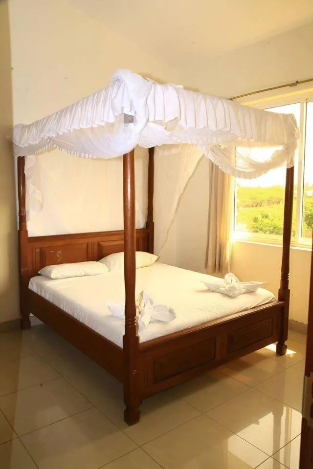 Bed in Nightingale Apartments Hotel Mombasa