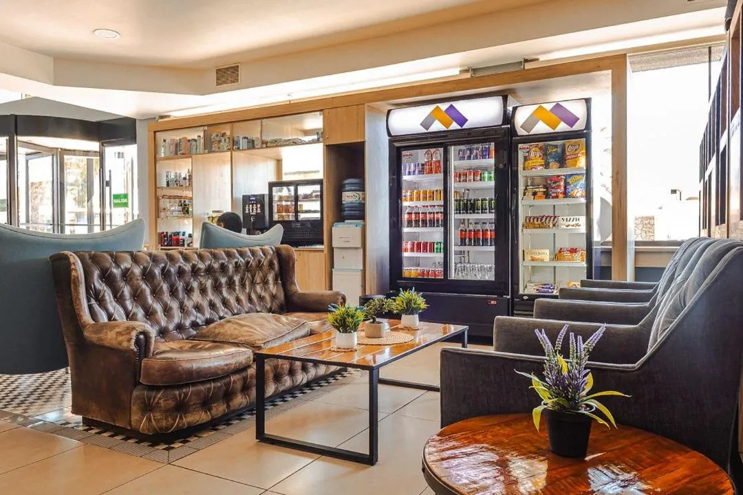 Communal lounge/ TV room in Hotel Modular Express Calama