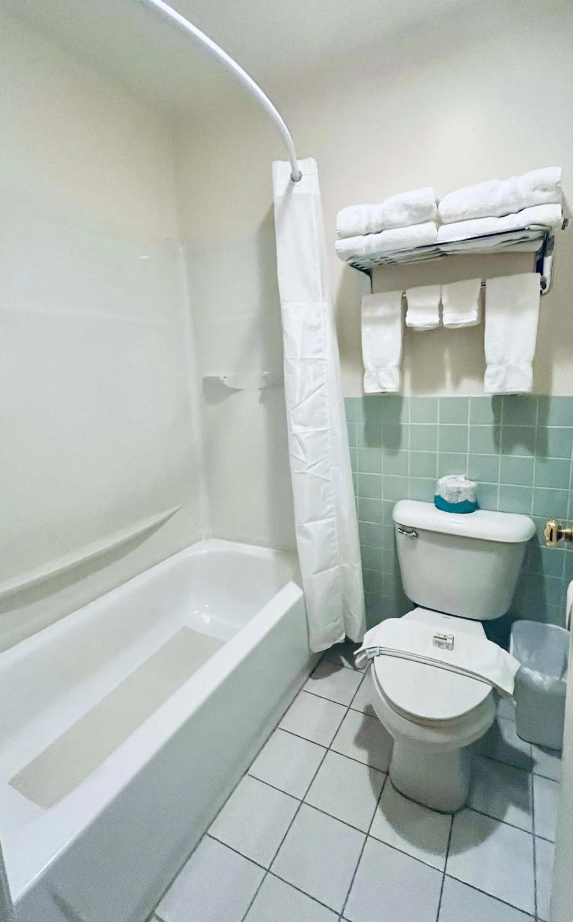 Toilet in Americas Best Value Inn Wall