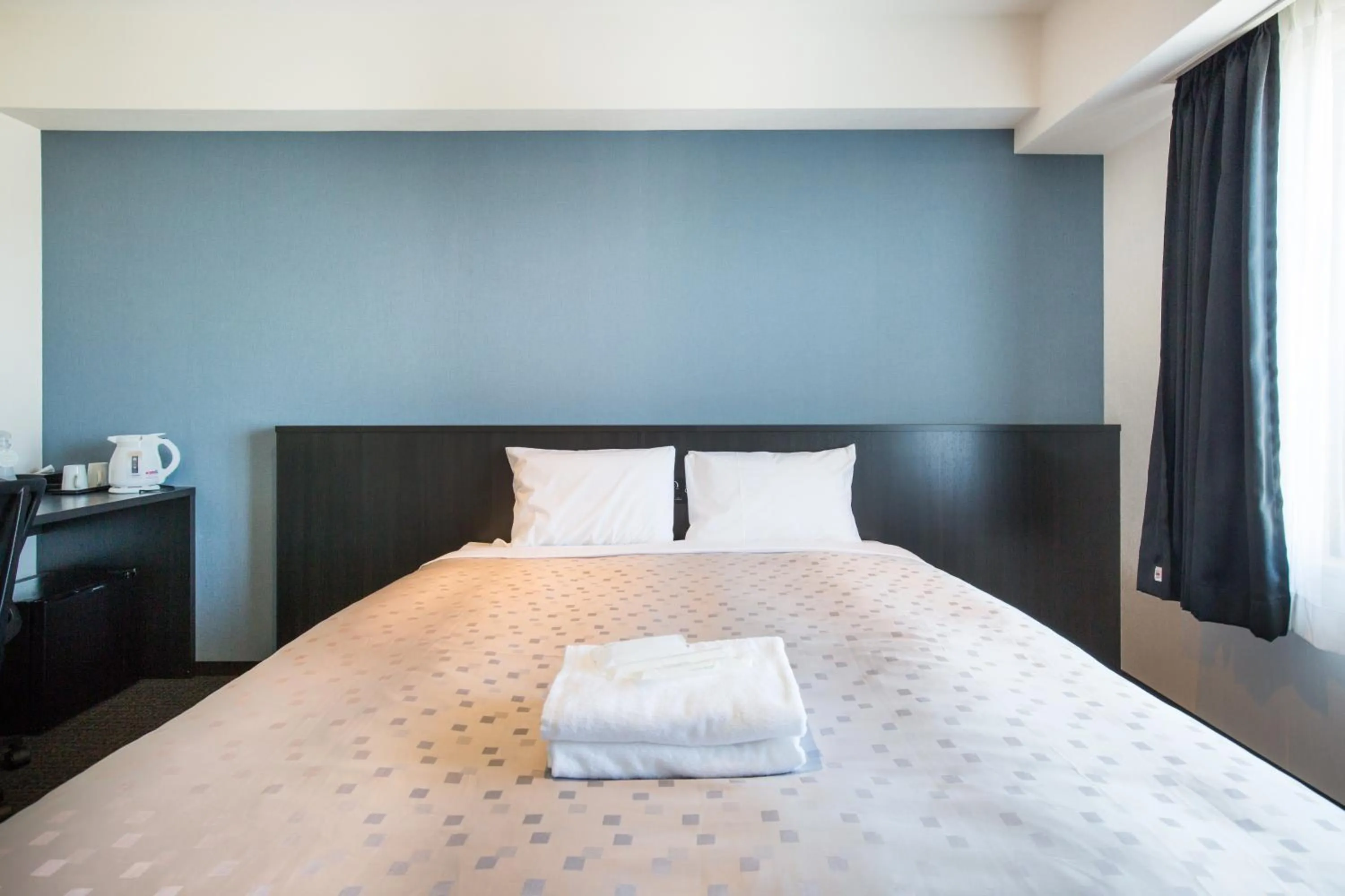 Bed in Hotel Bloemen North Hanazono