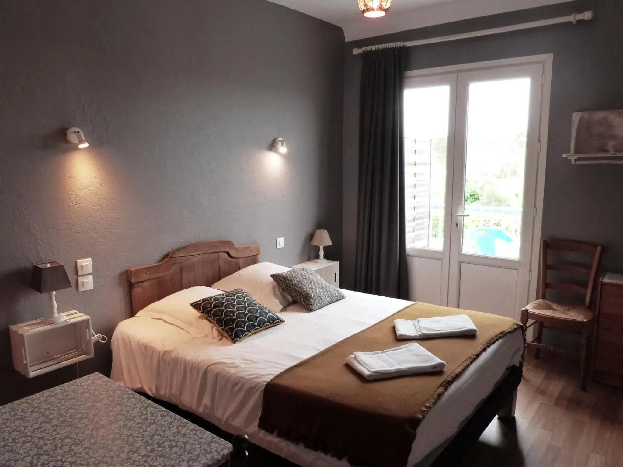 Photo of the whole room, Bed in Logis Hôtel Restaurant La Borie Photo of the whole room, Bed in Logis Hôtel Restaurant La Borie