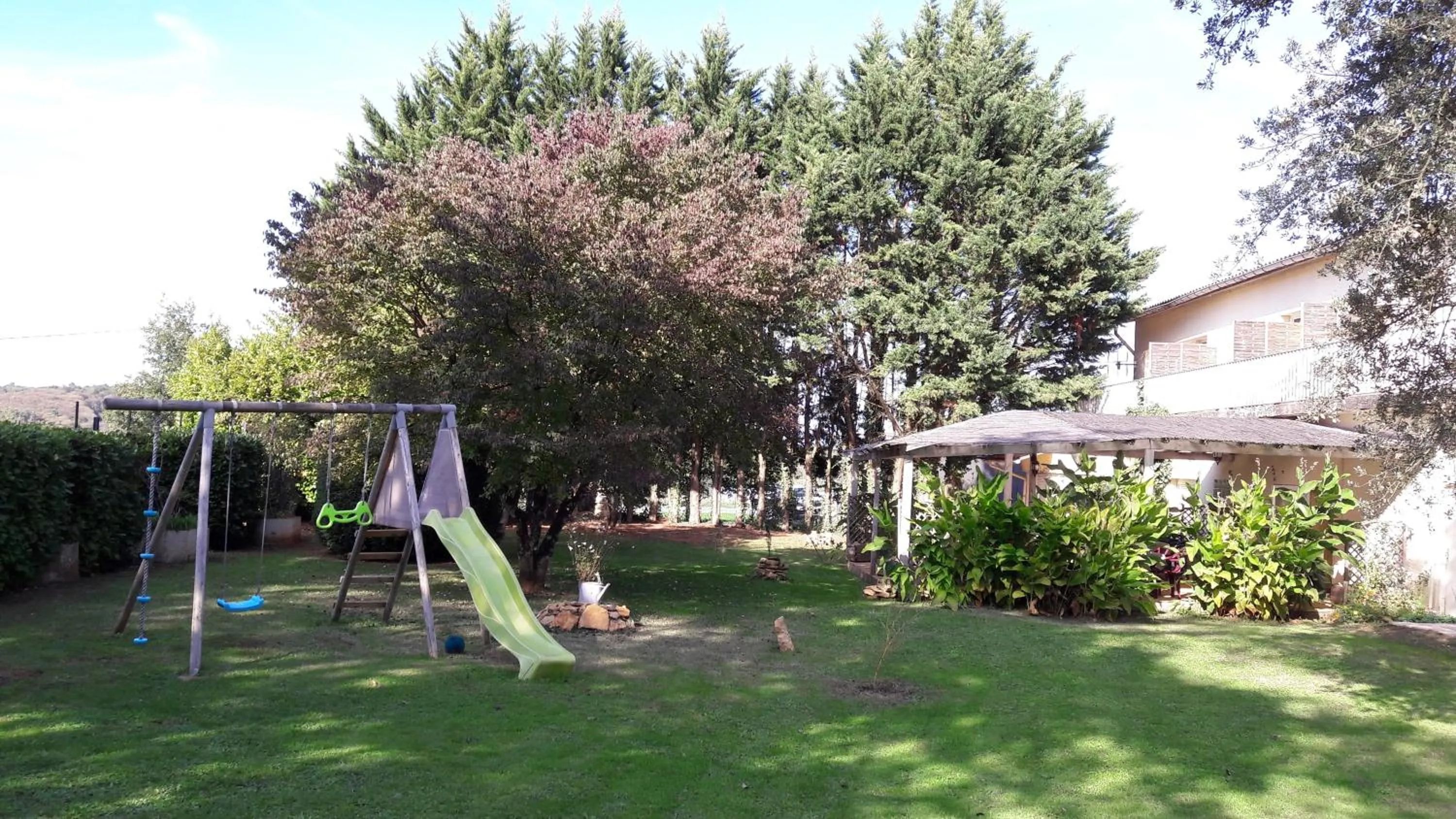 Garden in Logis Hôtel Restaurant La Borie