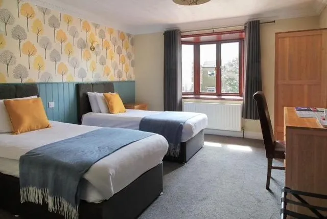 Bed in The Marine Hotel